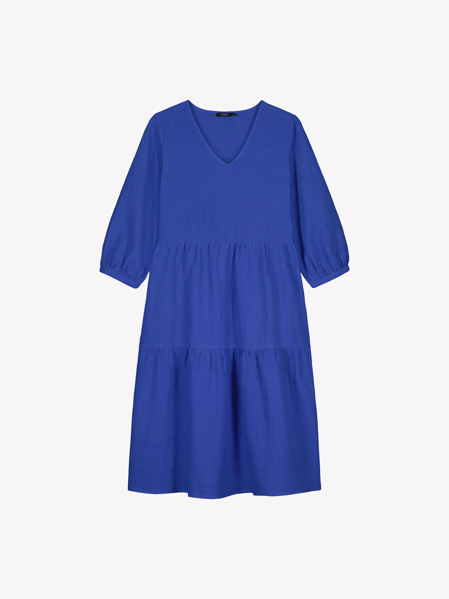 Nanso women's SARALIVIA linen dress in blue features charming layered ruffles, 3/4 sleeves, side pockets and a V-neckline. Product picture from the front.