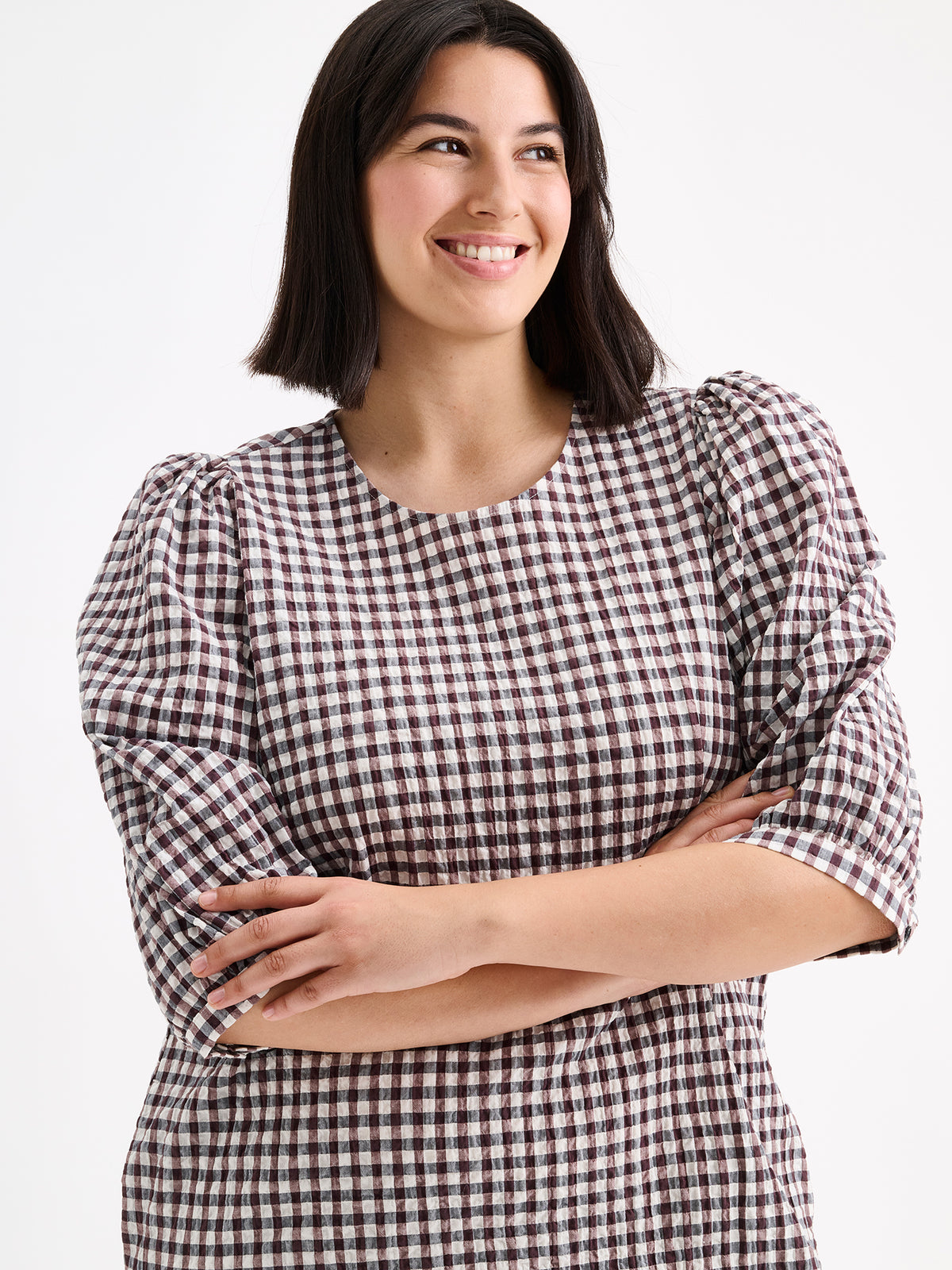 Nanso women's Treffit dress in a timeless brown and white check pattern, on a model close-up.