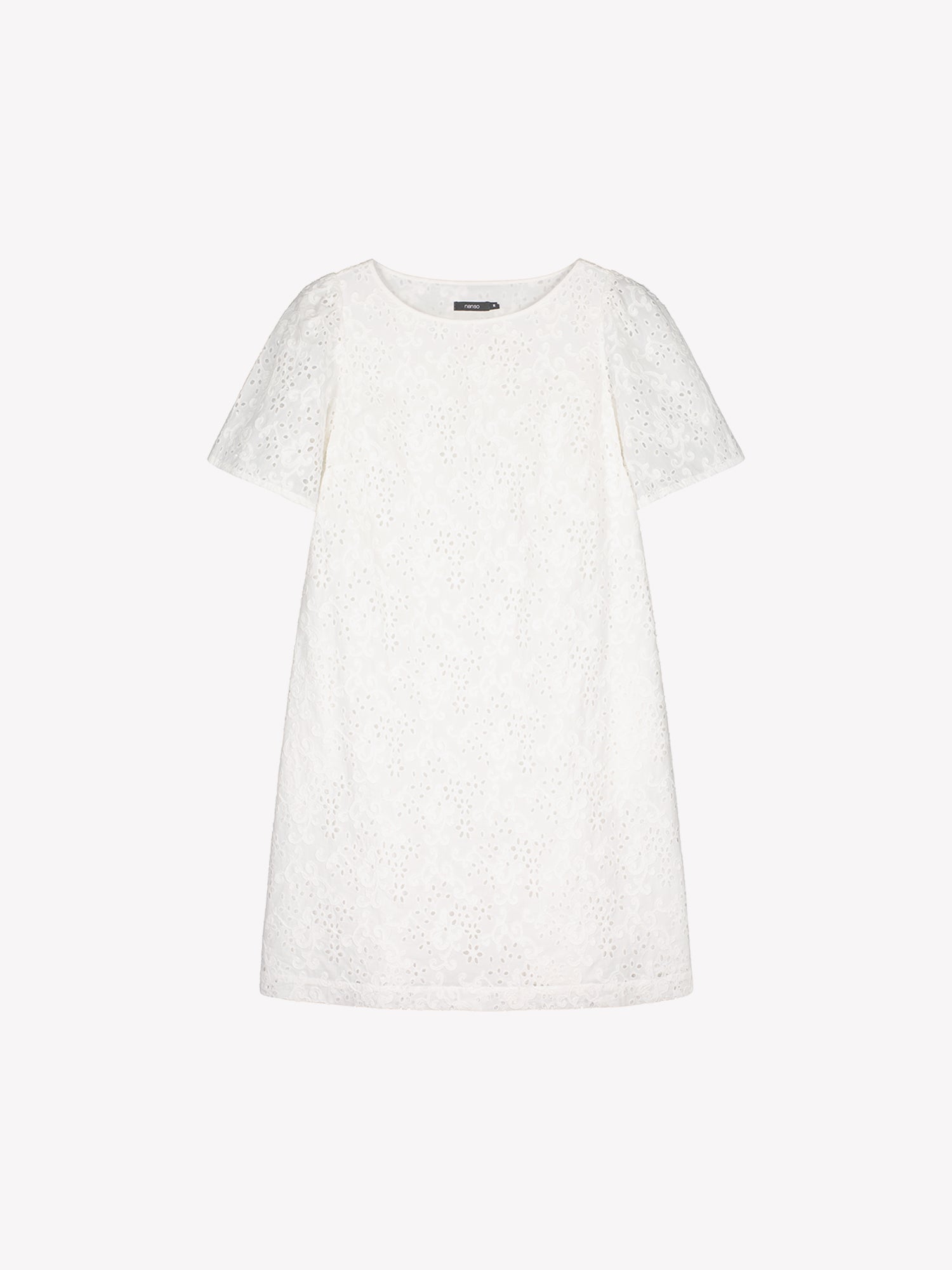 Nanso women's Odette Short Embroidered Dress in soft white, crafted from delicate broderie anglaise style cotton fabric in a product picture.