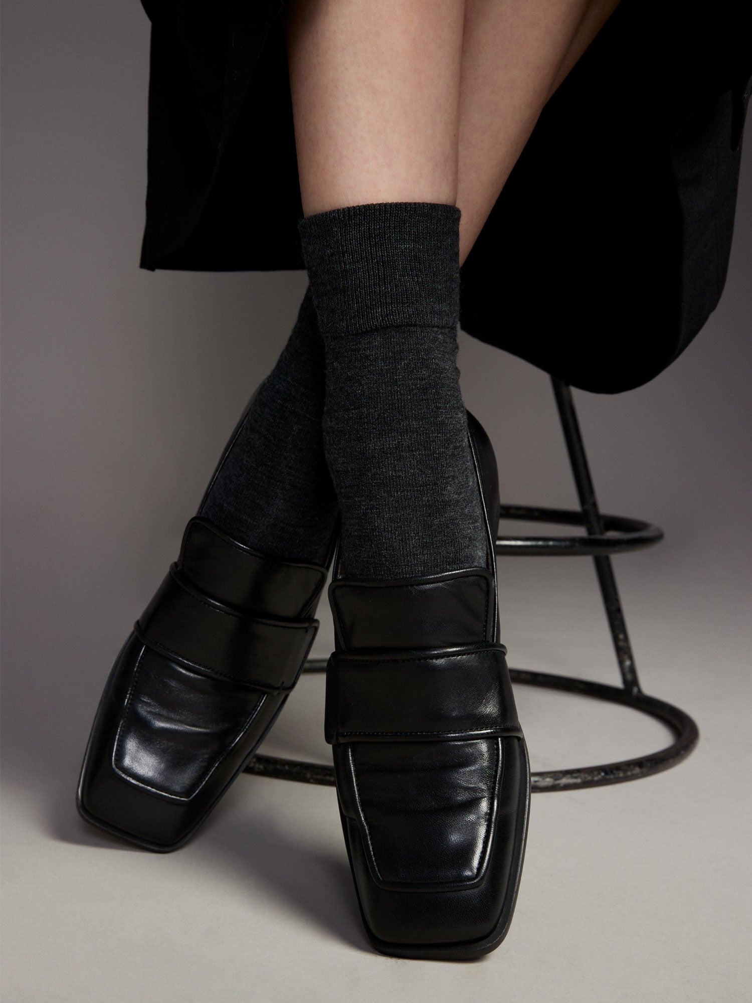 Vogue women's black merino wool ankle socks with soft terry sole and seamless toe construction, pictured on a model with shoes.