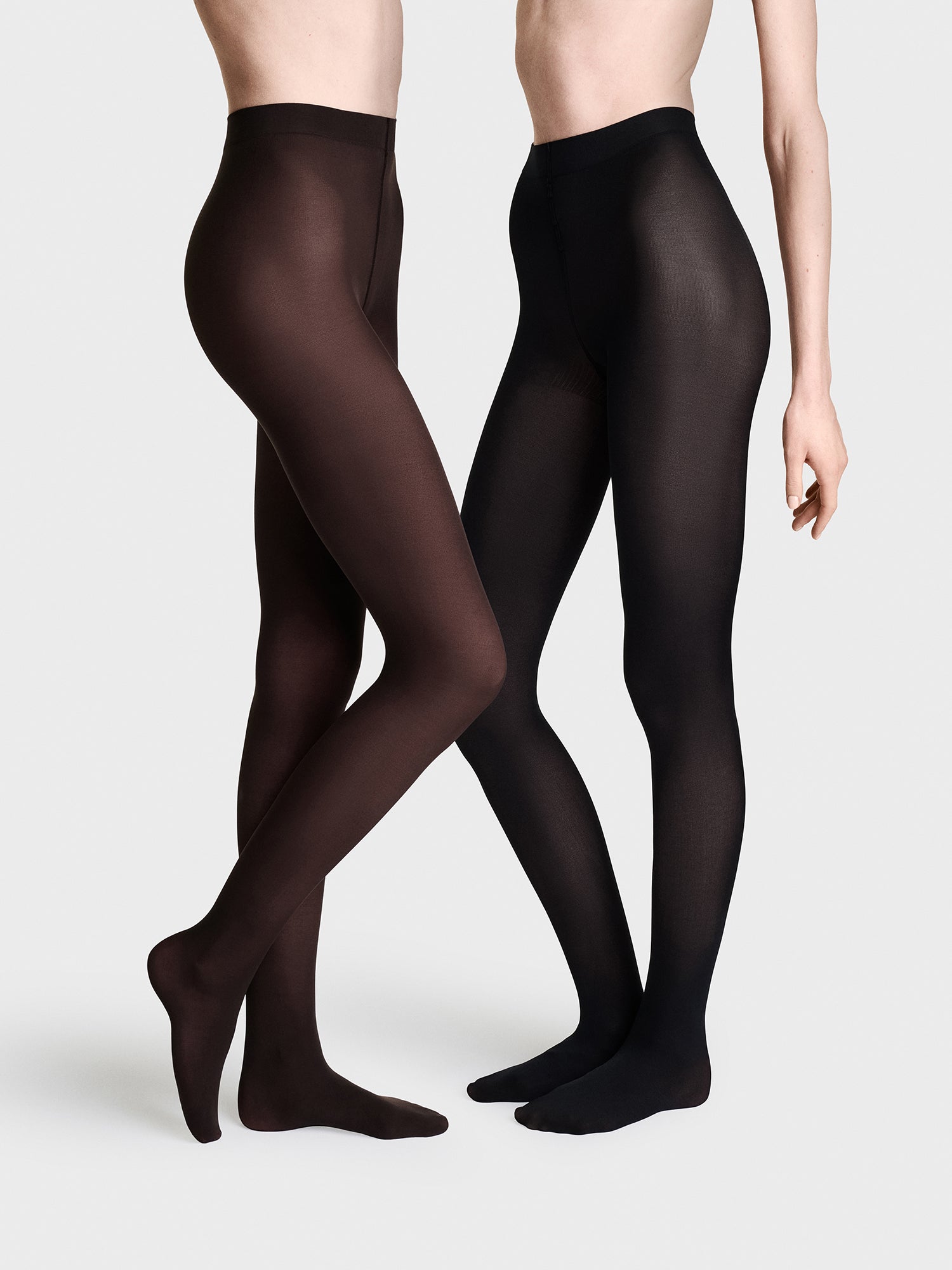 Vogue women’s 60 den matte tights in 2-pack in black and dark chocolate. These opaque microfiber tights offer a soft, second skin feel and a fashionable matte finish. Pictured on models