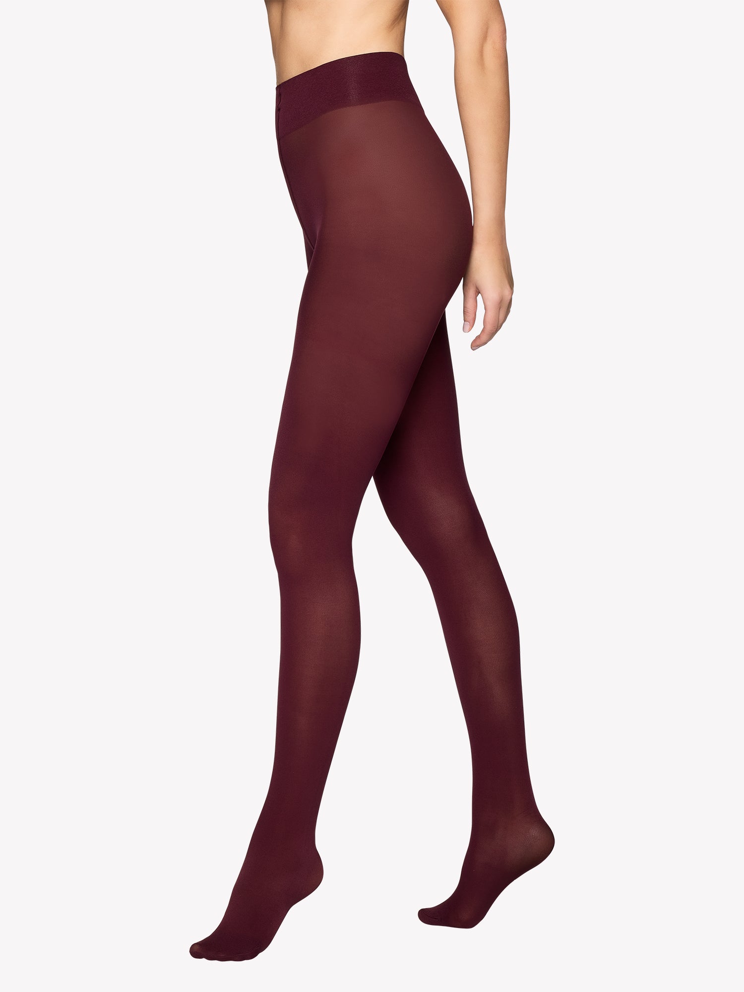 Vogue's 40 denier wine red matte tights worn by the model in product image.
