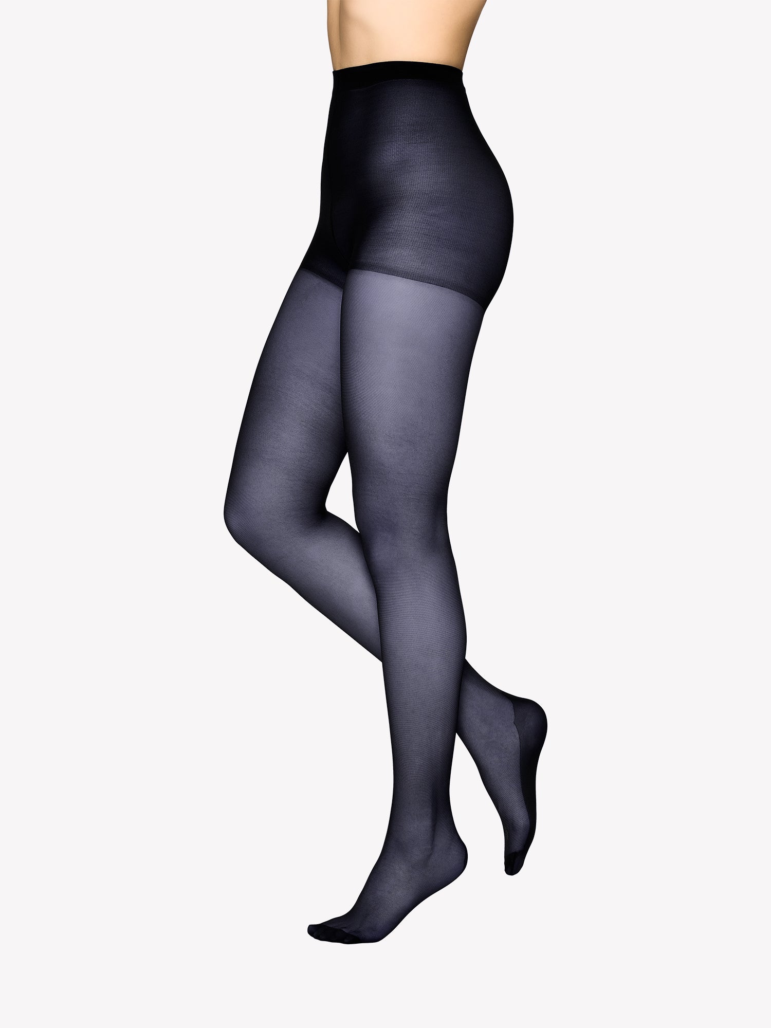 Vogue women's tights for everyday wear with a classic 20 denier matt finish in navy. The reinforced toe, sole, and heel provide extra durability for daily use. Pictured on a model.