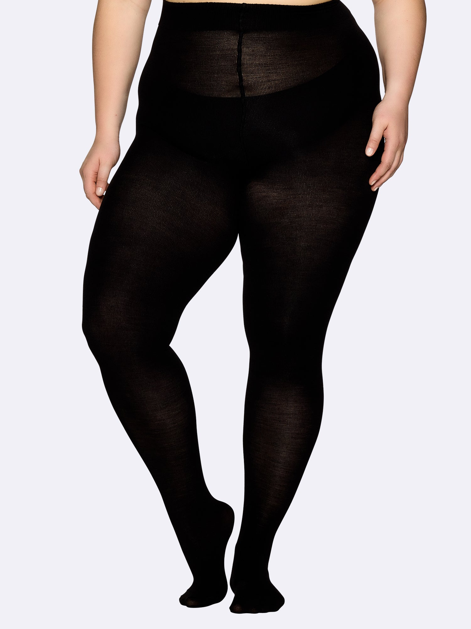 Women's Curvy Merino tights made from premium merino wool, thoughtfully designed for curvy silhouettes. Featuring a flat seam construction and gusset-free panty design. on a model from the front.