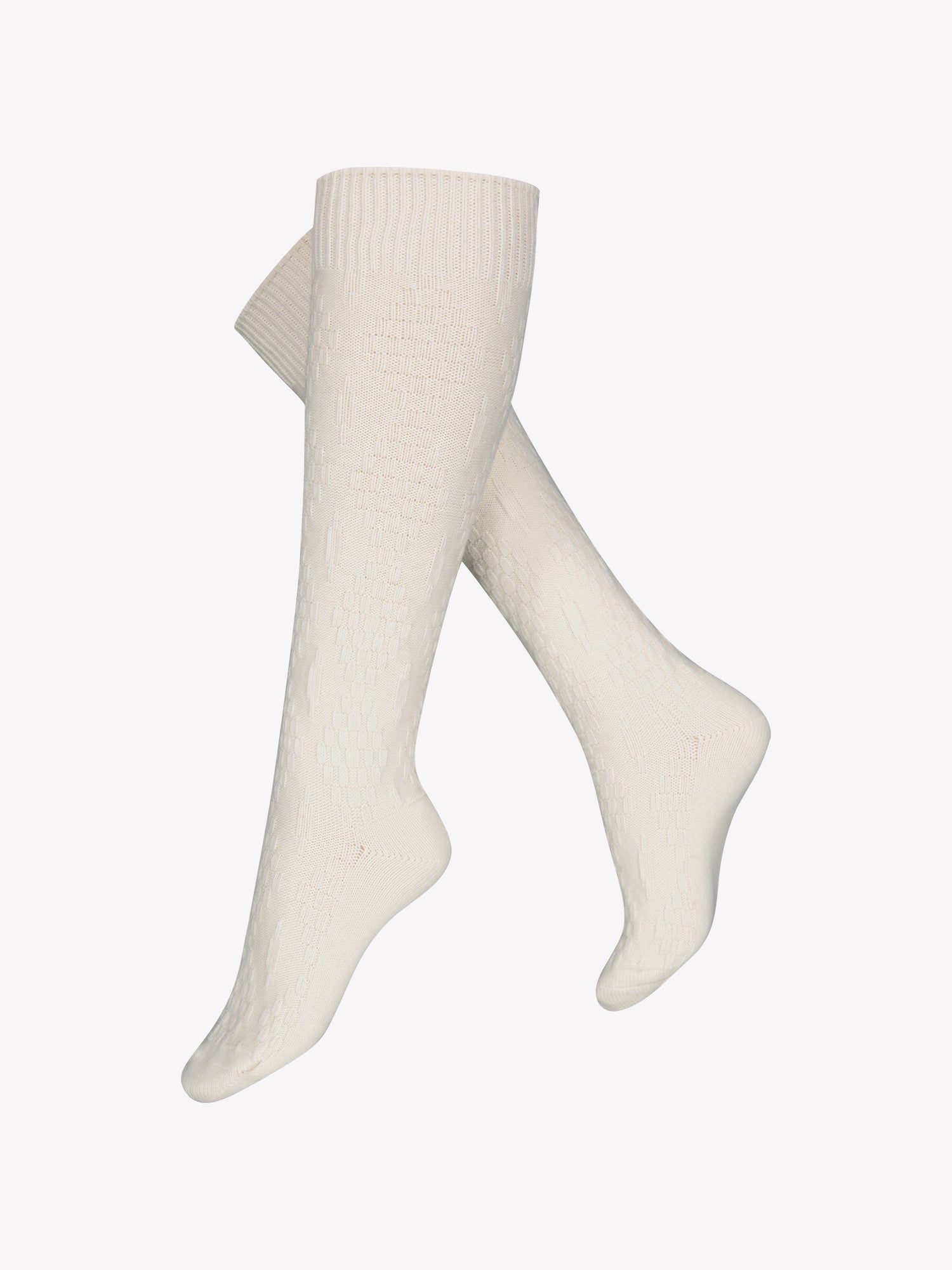 Vogue's Ciana wool knee socks in off-white featuring an elegant cable knit pattern in a product picture.
