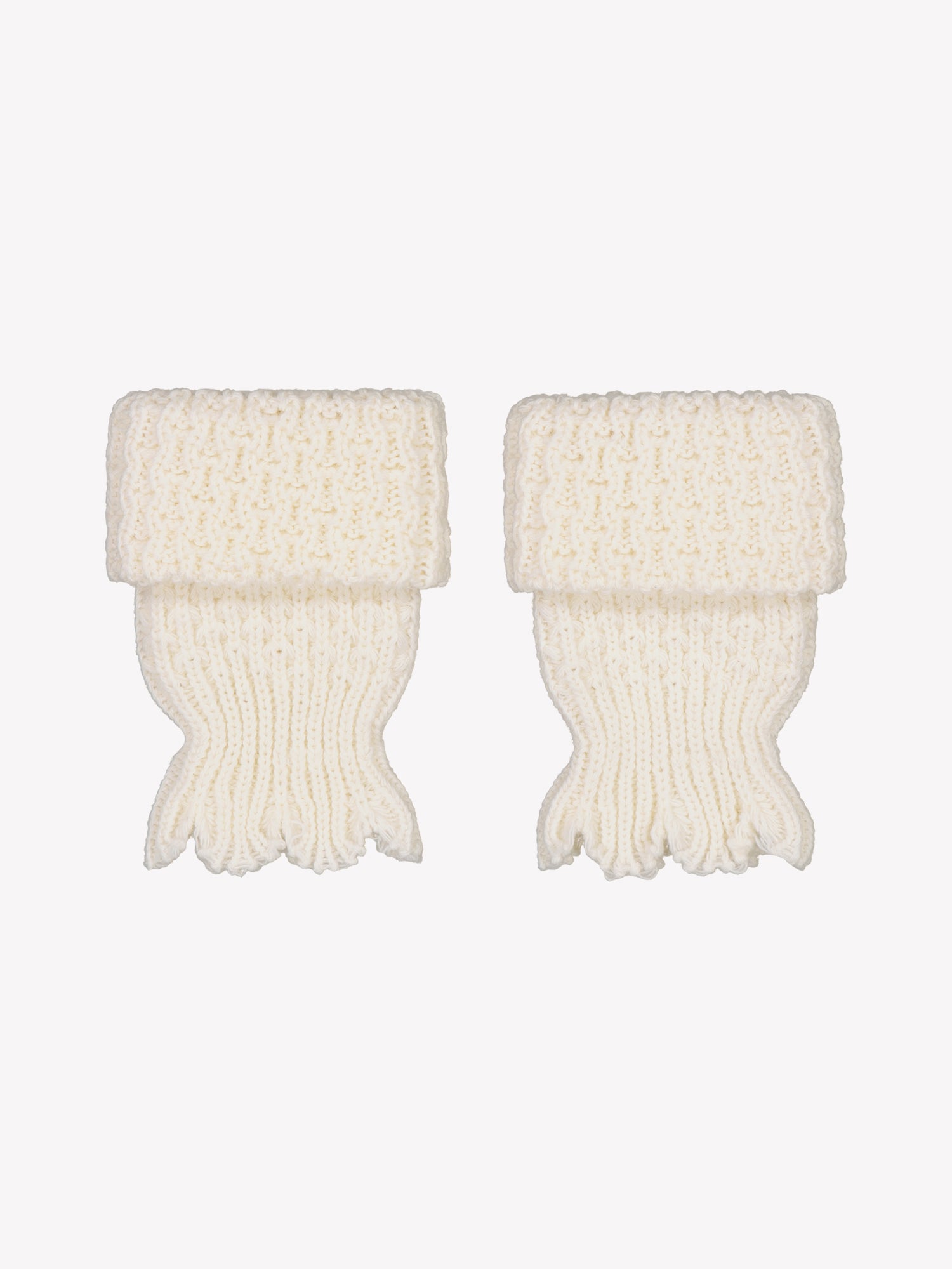 Vogue's off-white ankle warmers with cable knit pattern in a product picture.
