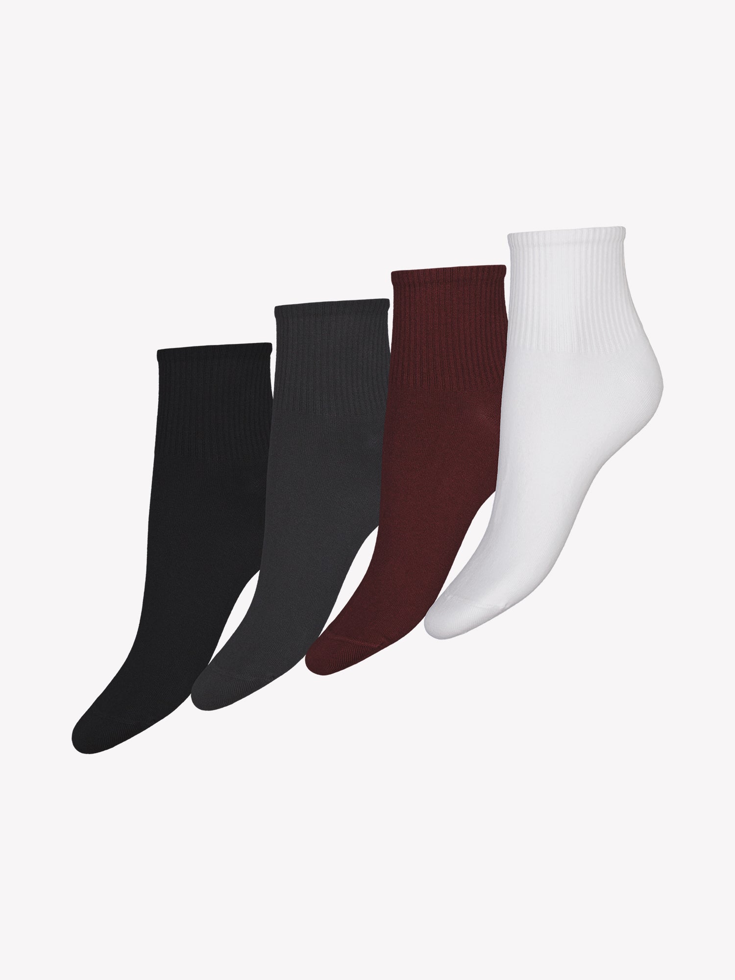 Vogue's organic cotton short socks one in white, one in dark grey, one in burgundy and one in black in a product picture.