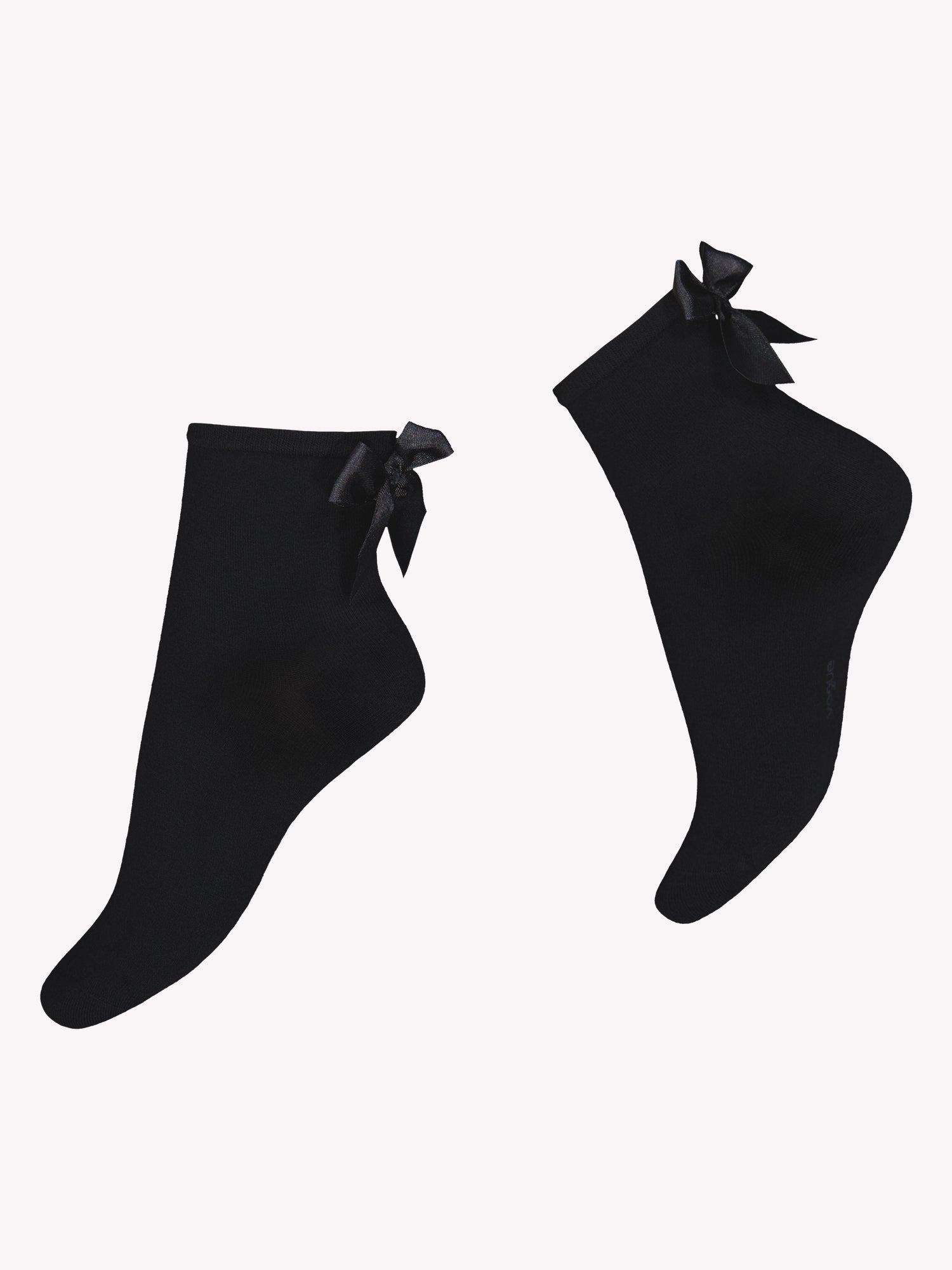 Vogue's black Brielle ankle socks from soft bamboo viscose. Featuring a black satin bow detail at the back of the sock cuff in a product picture.
