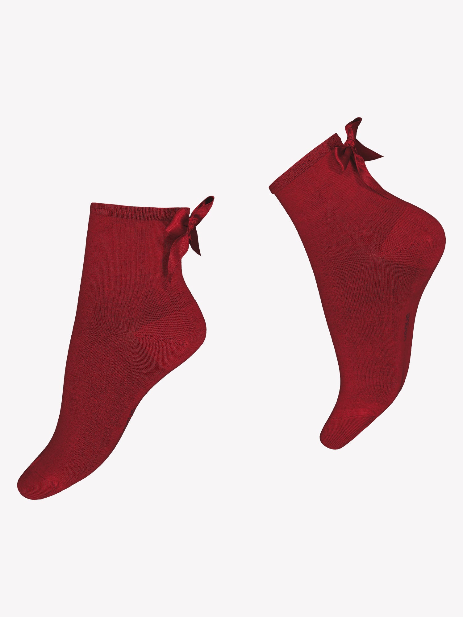 Vogue's scarlet red Brielle ankle socks from soft bamboo viscose. Featuring a scarlet red satin bow detail at the back of the sock cuff in a product picture.