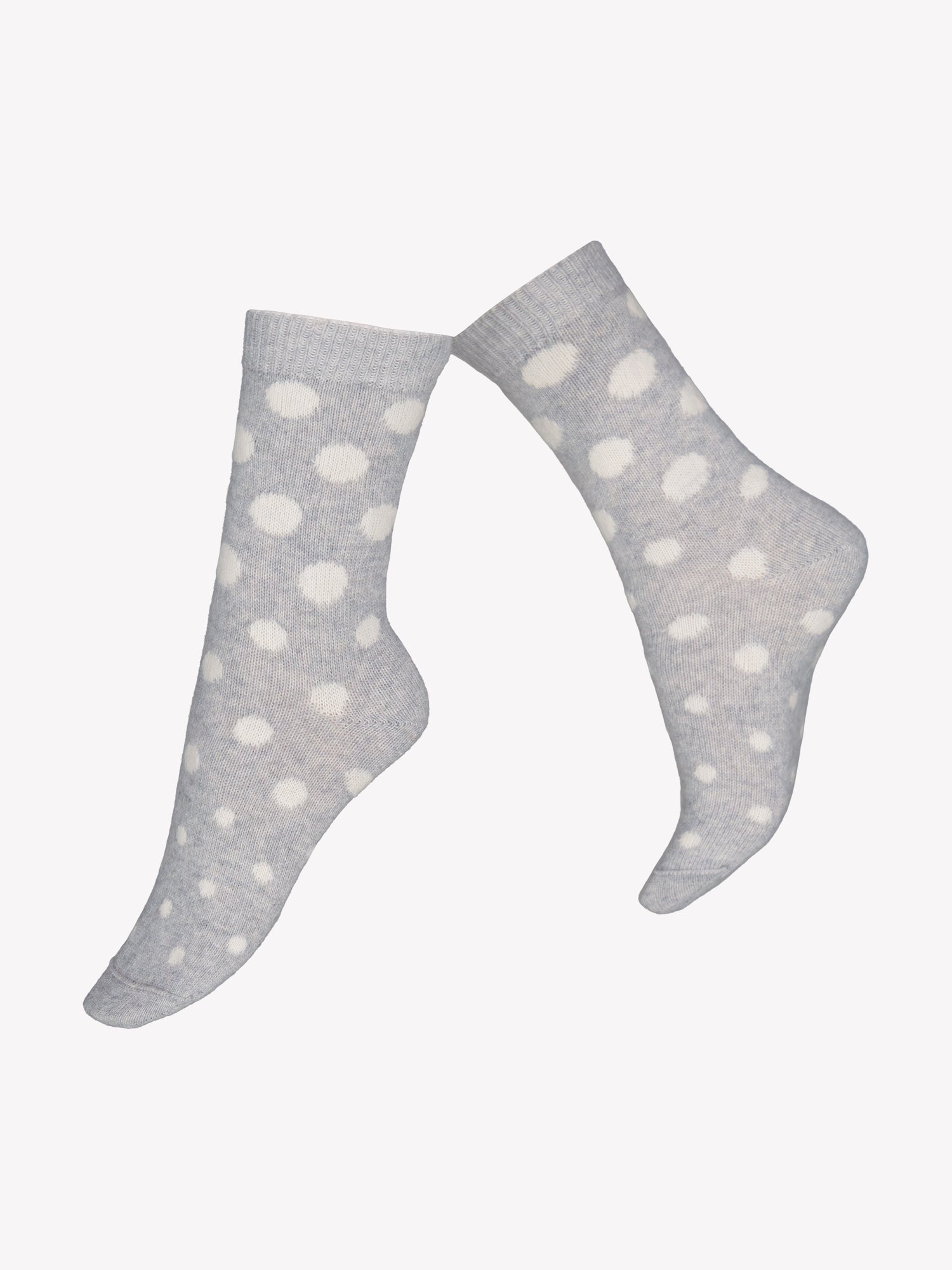 Vogue's soft cashmere-blend socks with a charming polka dot pattern in a product picture