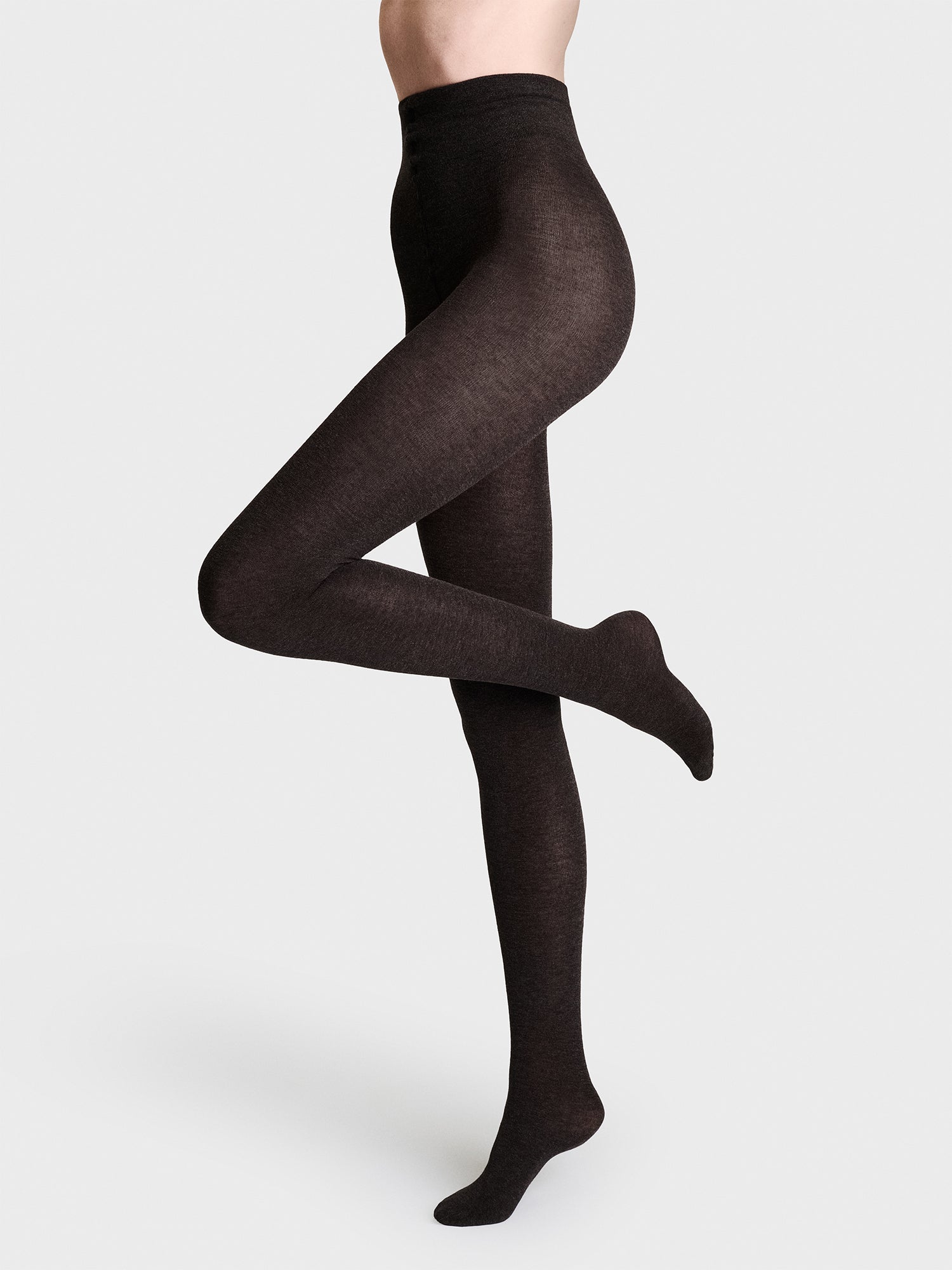 Luxuriously soft classic dark brown cashmere-blend tights, on a model