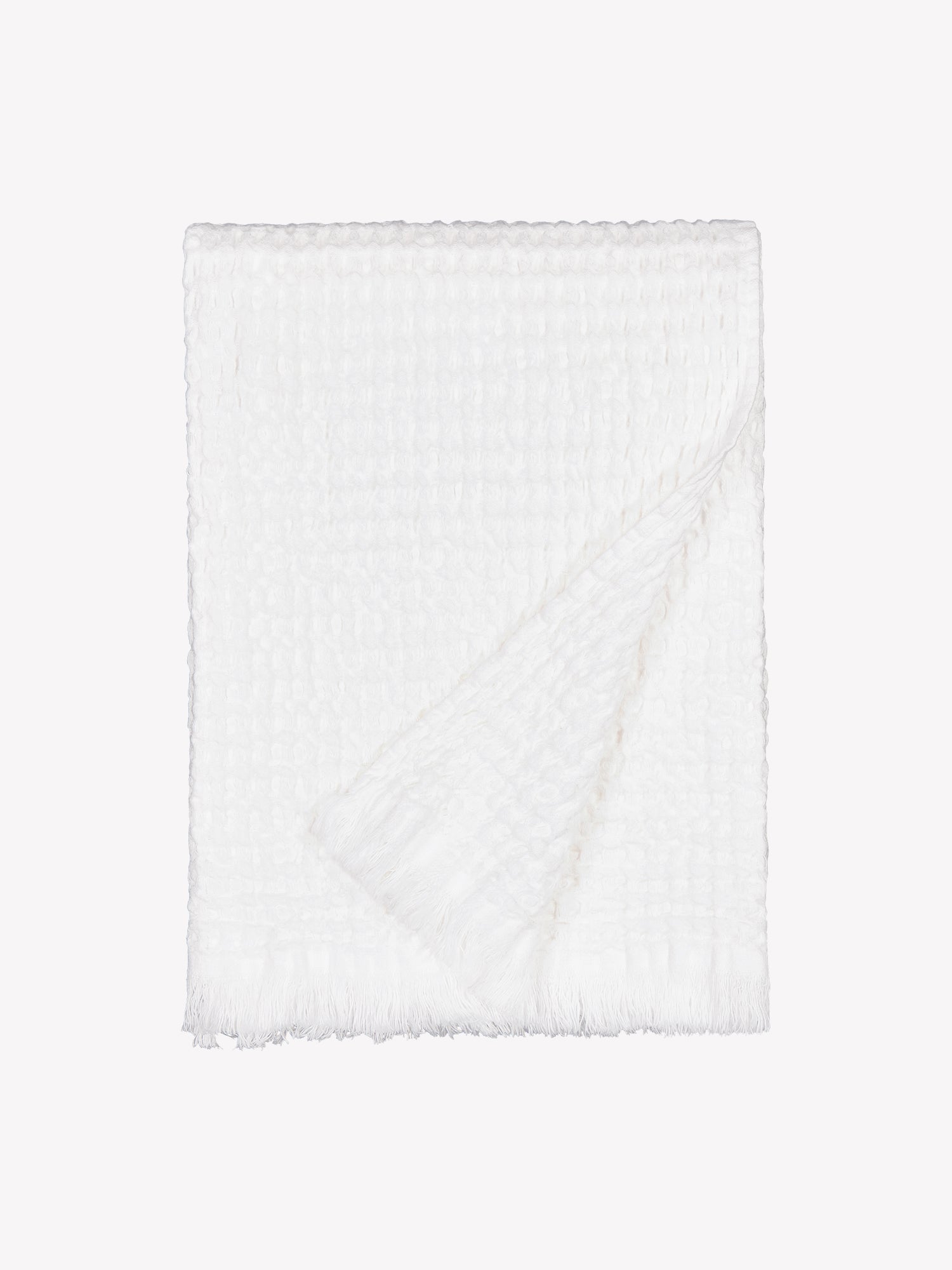 Nanso home's Vohveli Bath towel in white folded