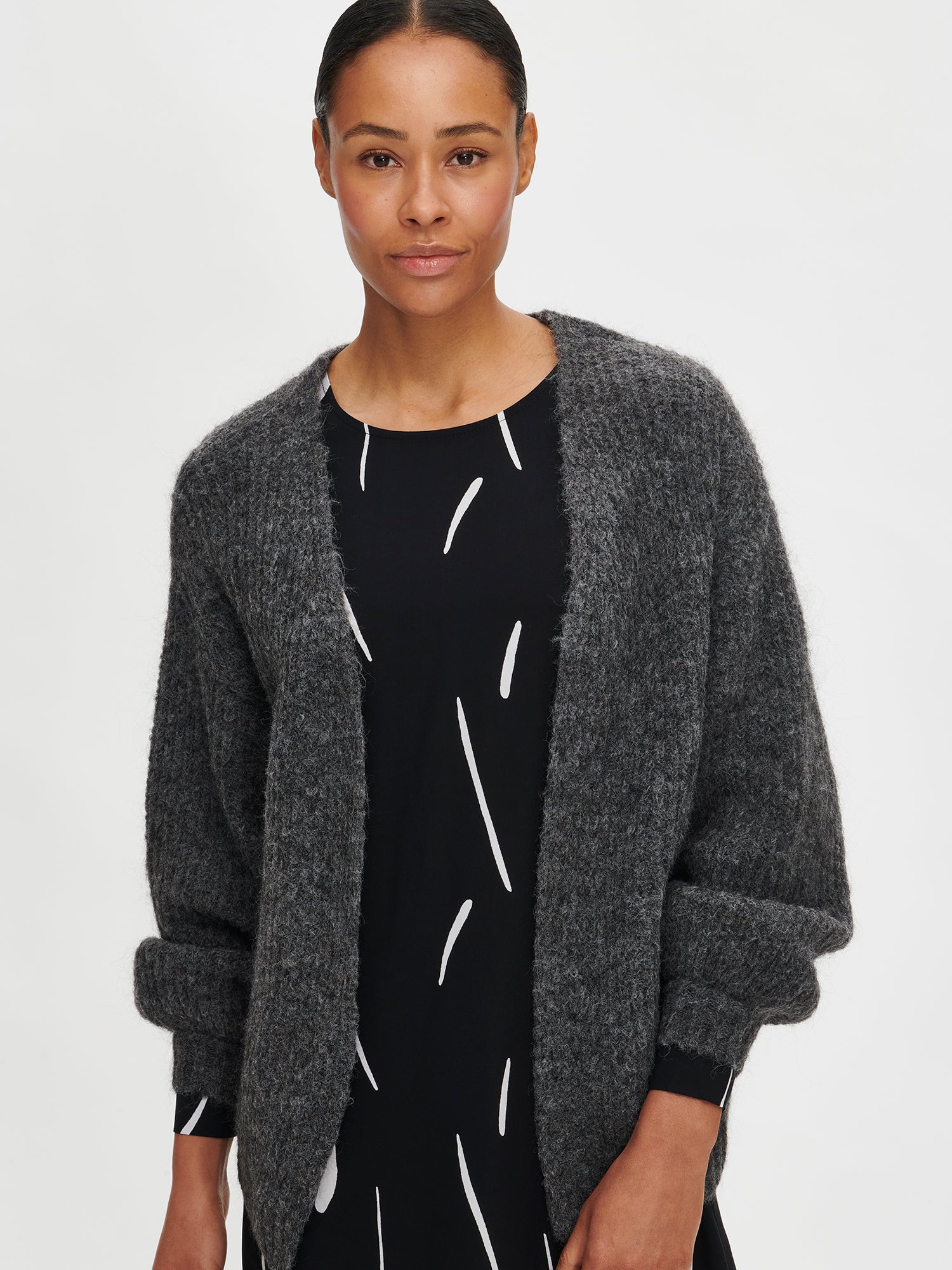 Nanso's women's luxurious grey knit Karamelli cardigan on a model