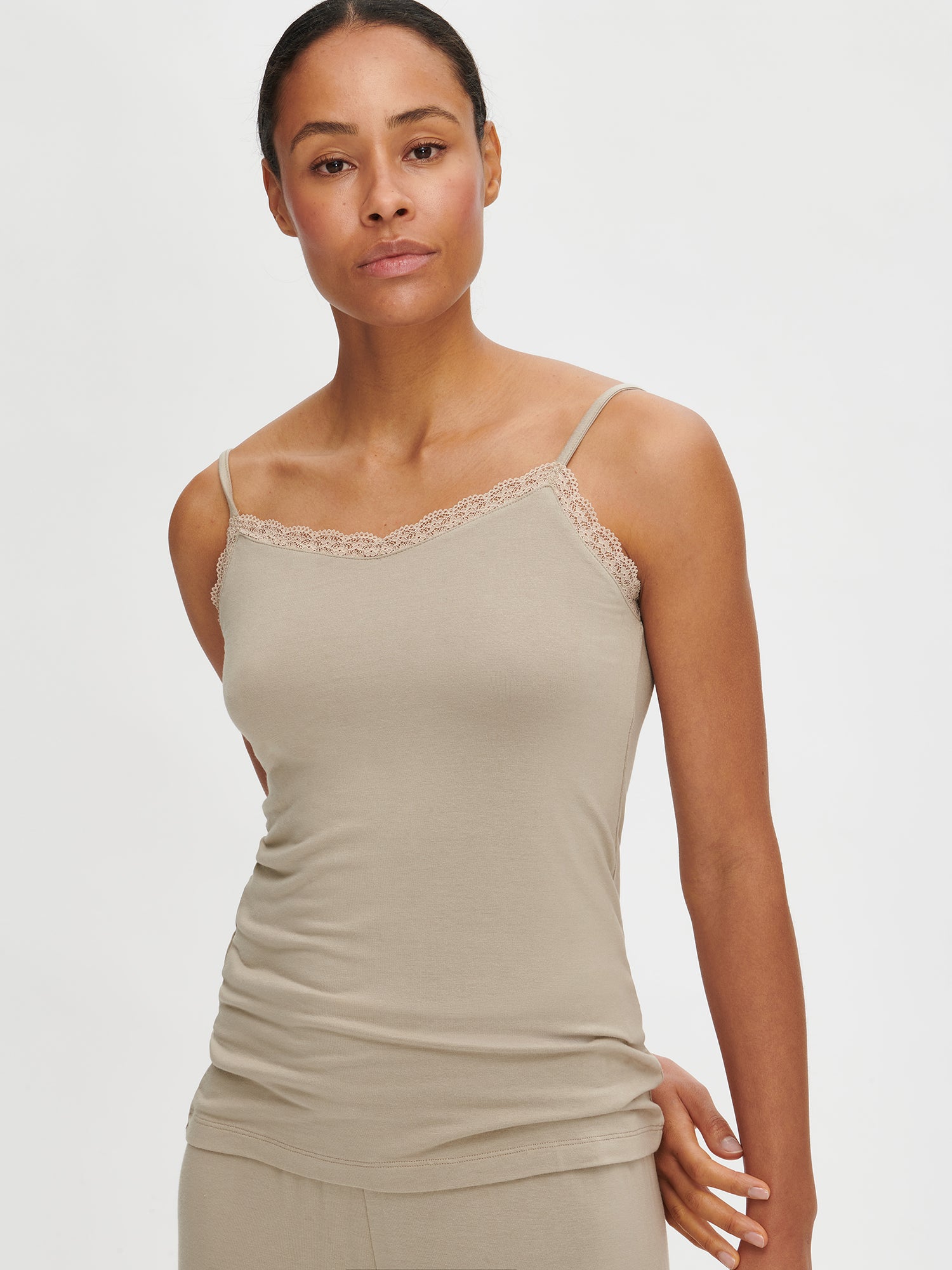 Nanson women's luxuriously soft brown Pitsi top with spaghetti straps, worn by the model in a close-up front view.