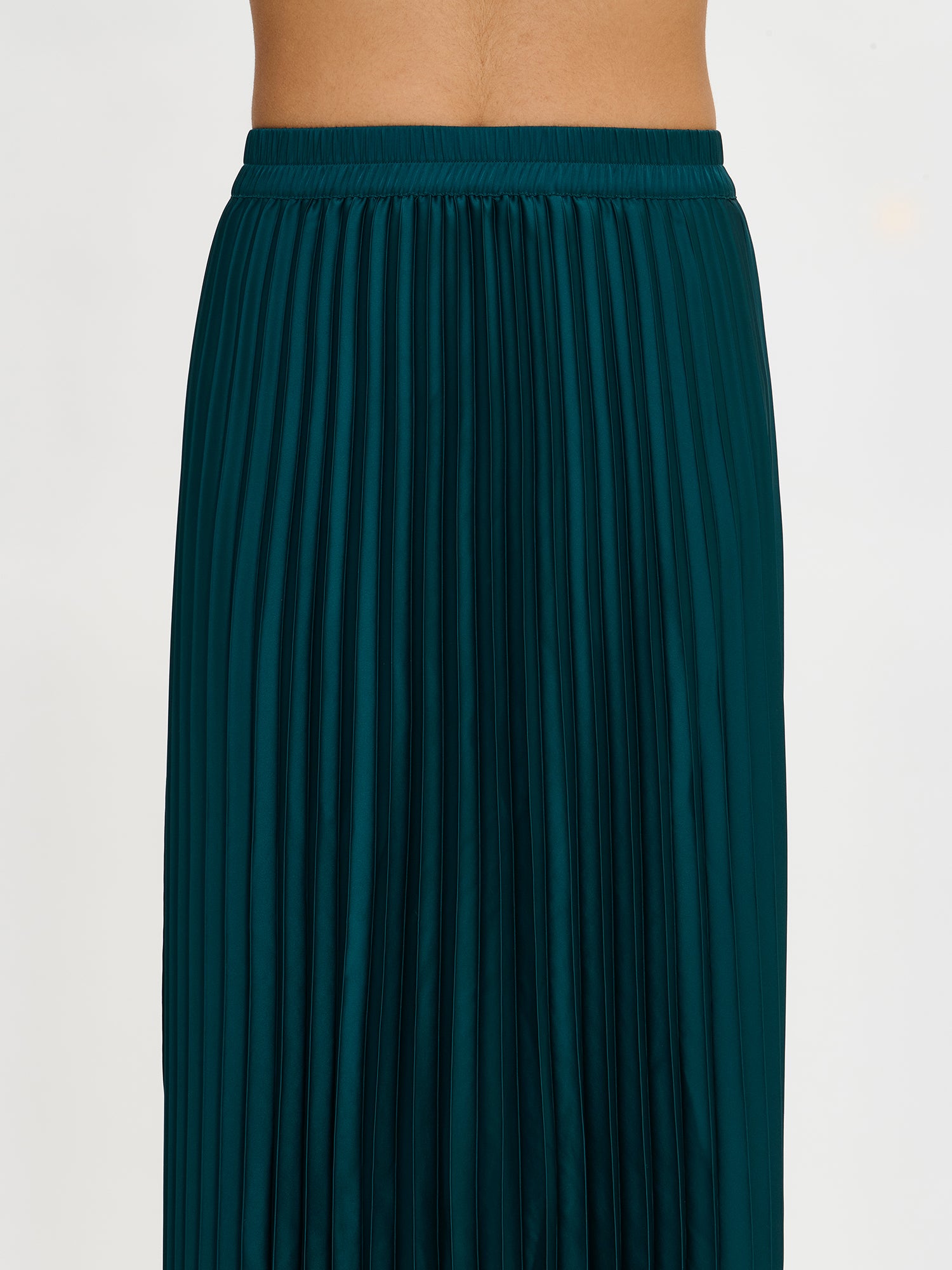 Nanso's elegant Taite skirt for women features a graceful drape in green shade, front
