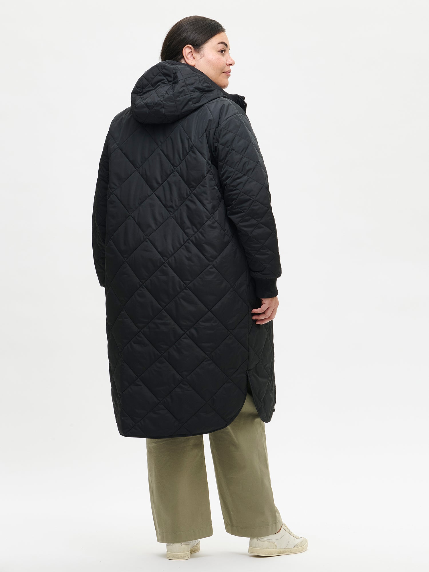 Nanso women's casual black Maxi quilted coat with light padding and a cozy hood. On a model in size XL, back