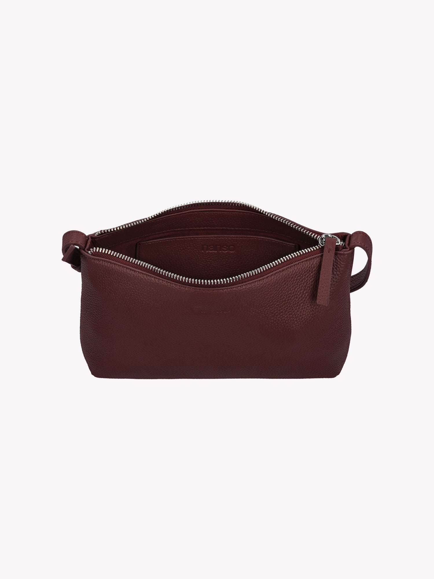 Nanso sleek burgundy Naru leather bag comes with a long, adjustable shoulder strap and a secure zip closure, detail