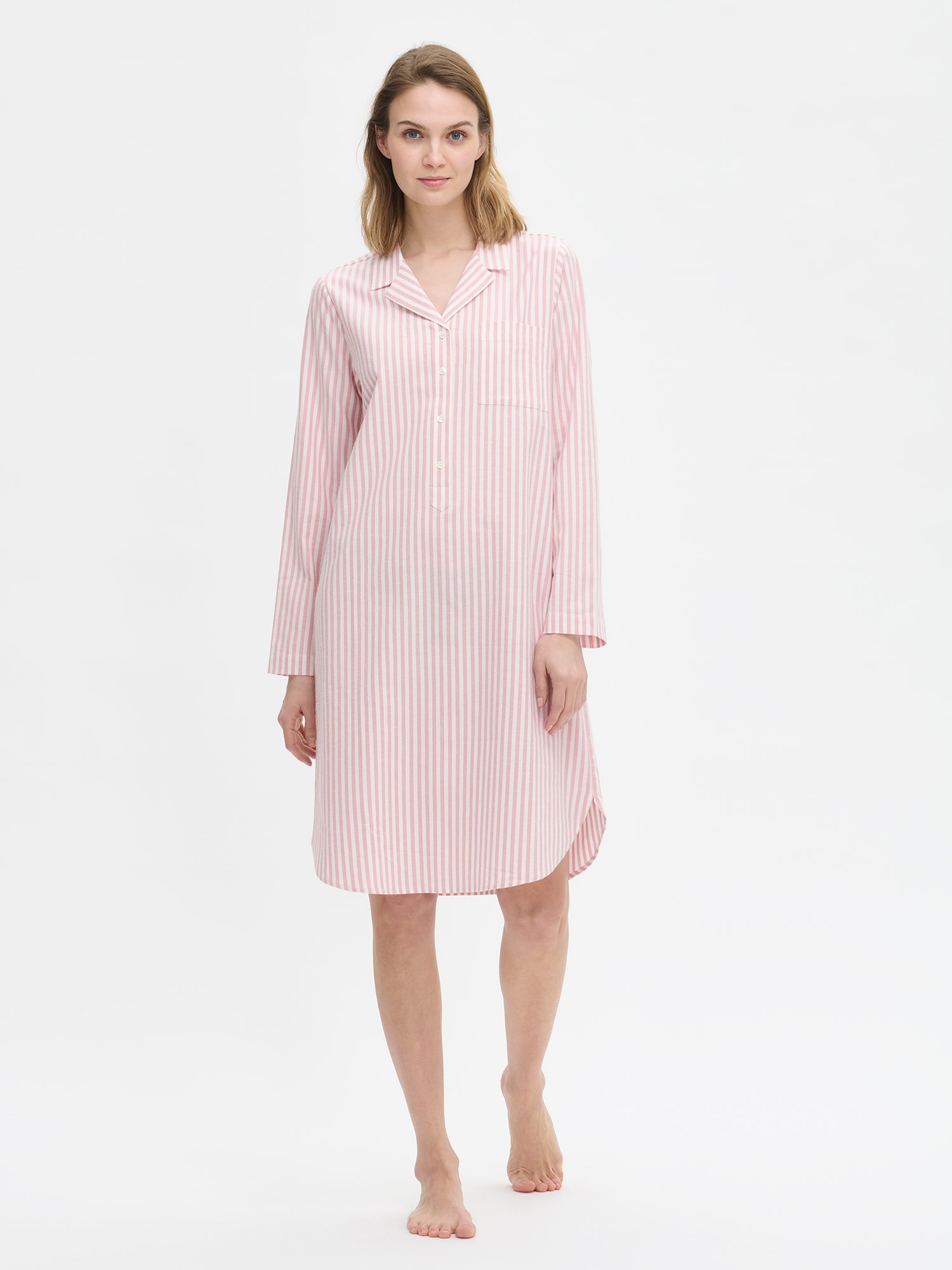 Nanso Polka pink women’s long-sleeved striped flannel dress with collar and curved hem, worn by model.