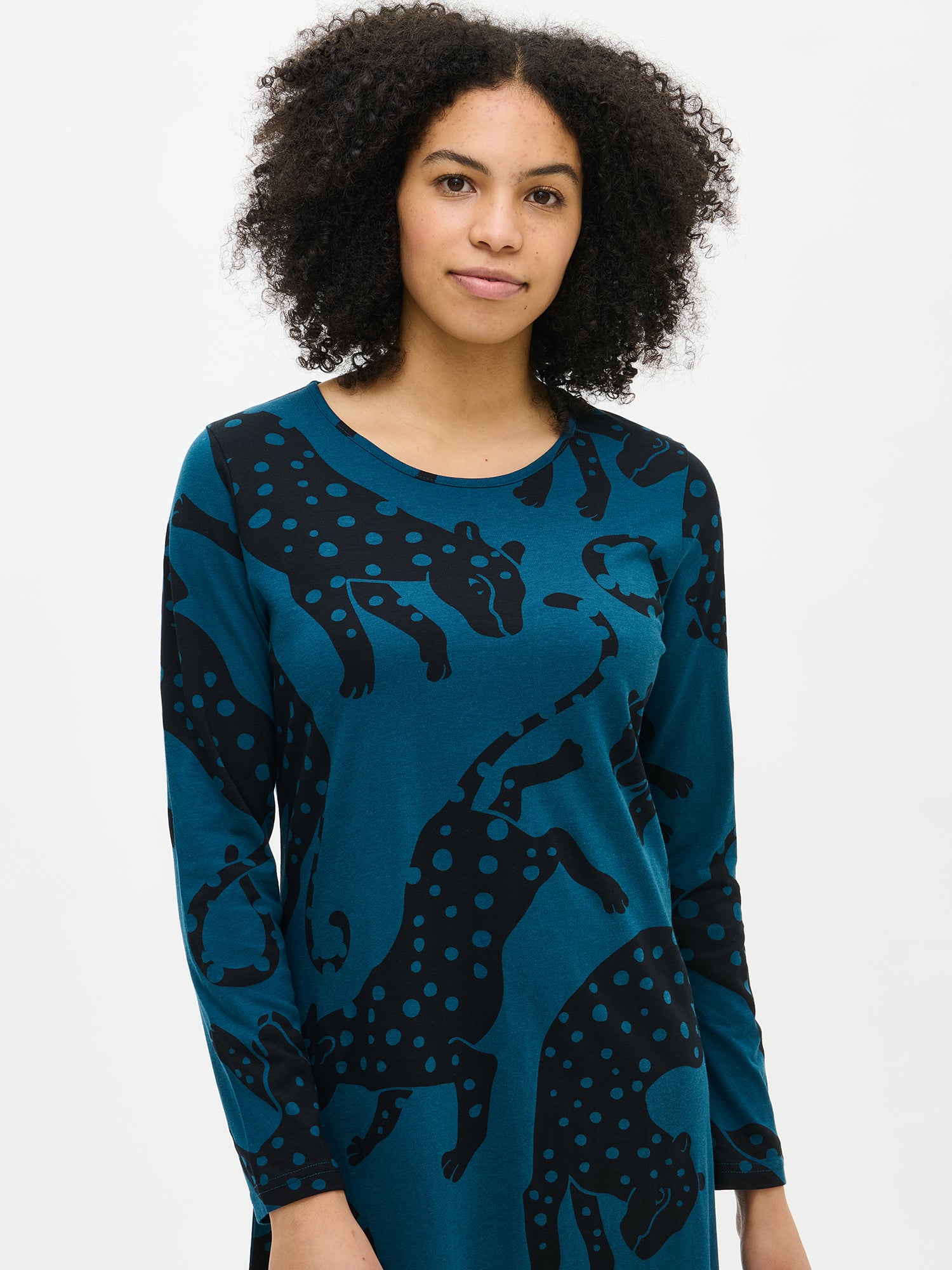 Nanso women’s blue patterned Leonora nightgown with round neckline, worn by model in close-up from the front. Print and fabric texture visible.