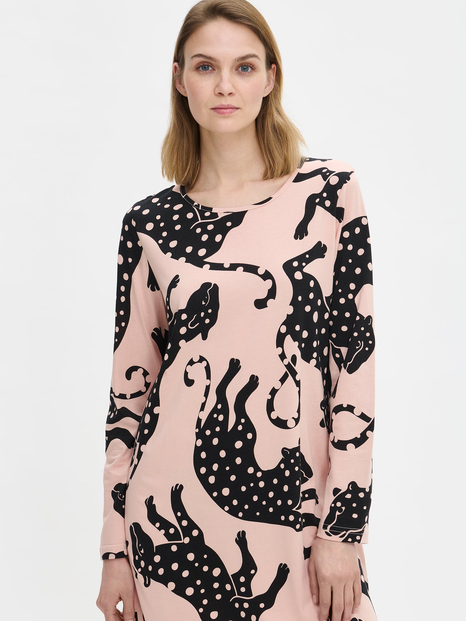 Nanso women’s pink patterned Leonora nightgown with round neckline, worn by model in close-up from the front. Print and fabric texture visible.