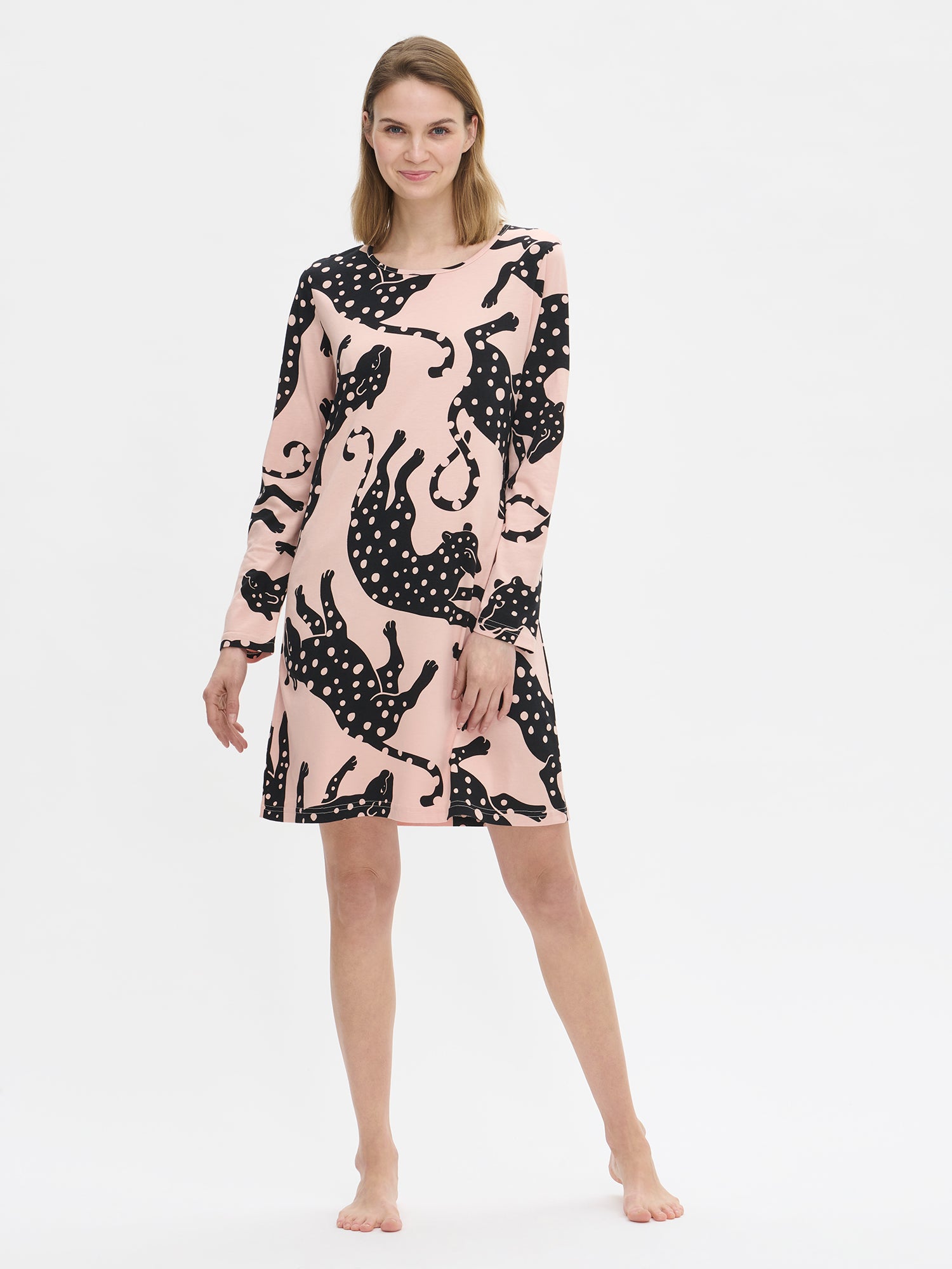 Nanso women’s pink Leonora nightgown with long sleeves and round neckline, worn by model from the front. Hemline falls above the knees.
