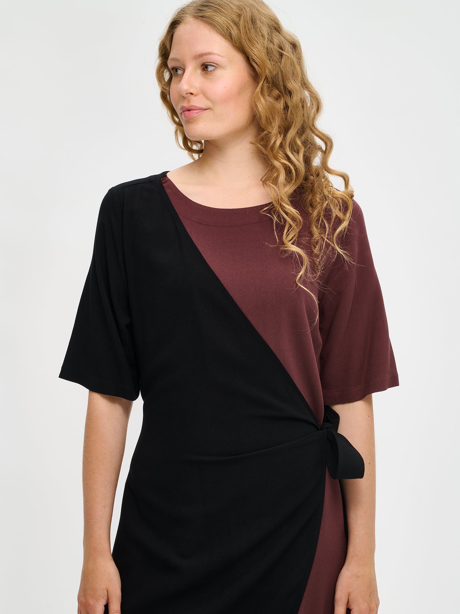 Nanso women's brown-black Lyyra dress features a chic wrap design close-up