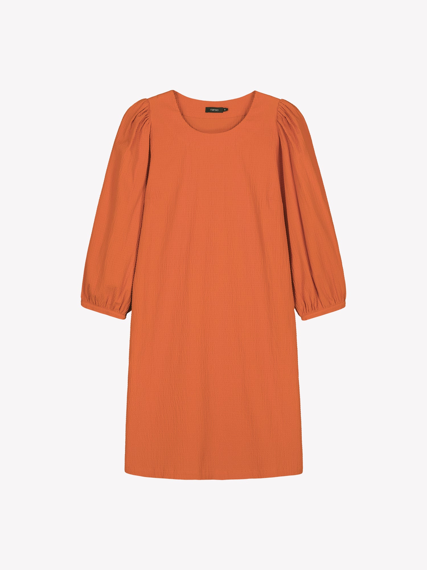 Nanso women’s solid orange Bianca dress in cotton–elastane, round neckline, gathered sleeves and pockets, knee-length, product photo front view.