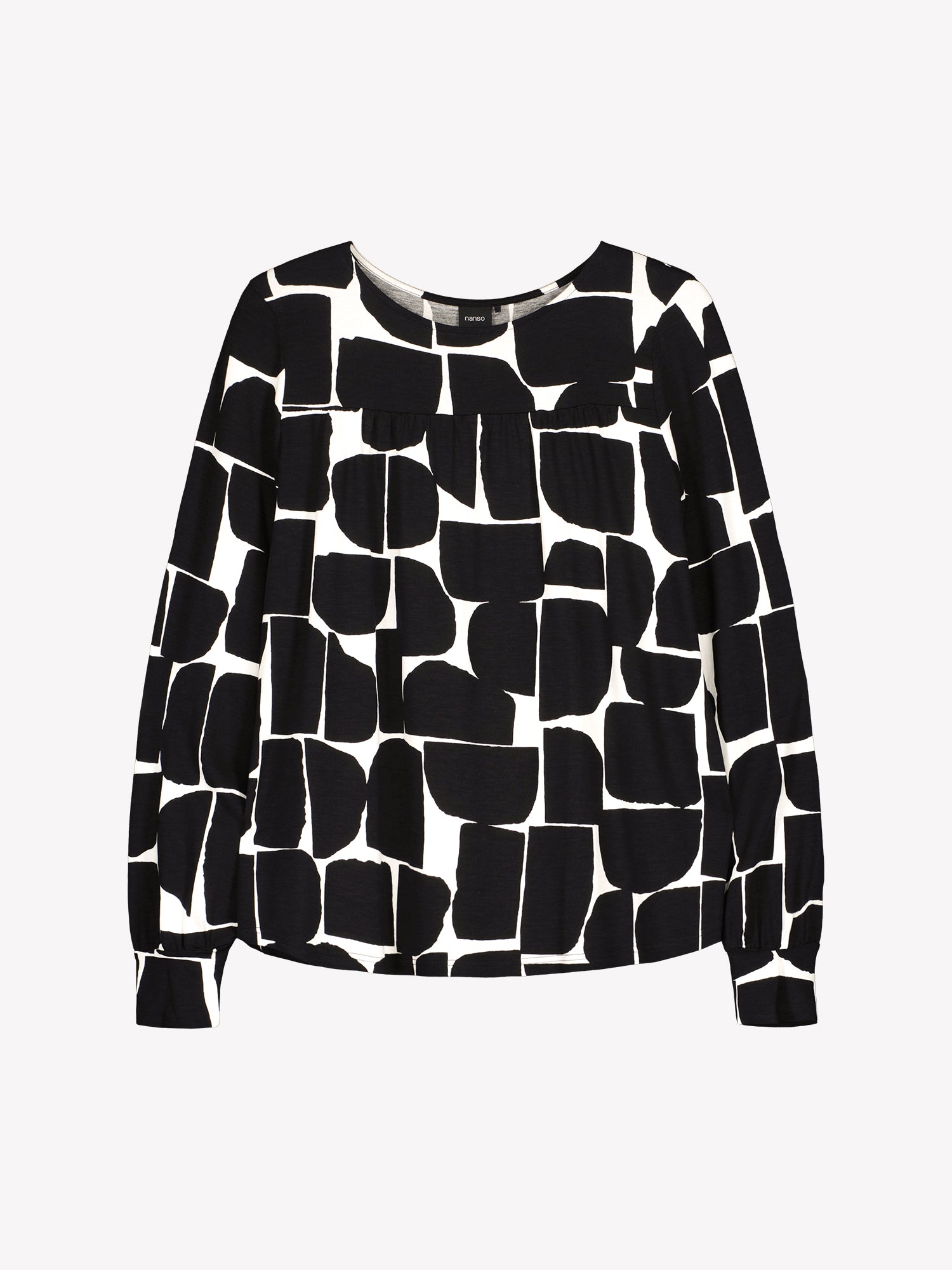 Nanso women’s black and white patterned Muuri top in viscose–elastane knit, round neckline and gathered yoke, product photo front view.