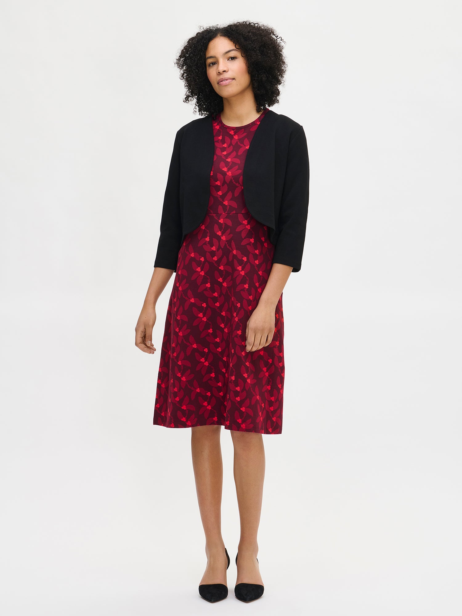 Nanso women’s black Opera bolero, waist-length short style with round neckline and three-quarter sleeves, worn by model in full-body photo.