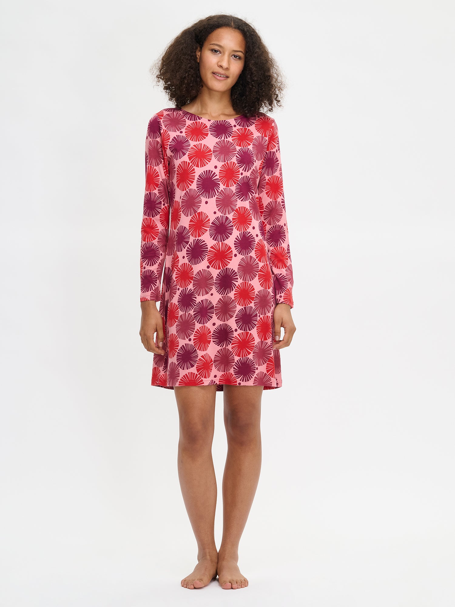 Nanso Amara red women’s long-sleeved short nightgown with oval neckline, knee-length, worn by model.