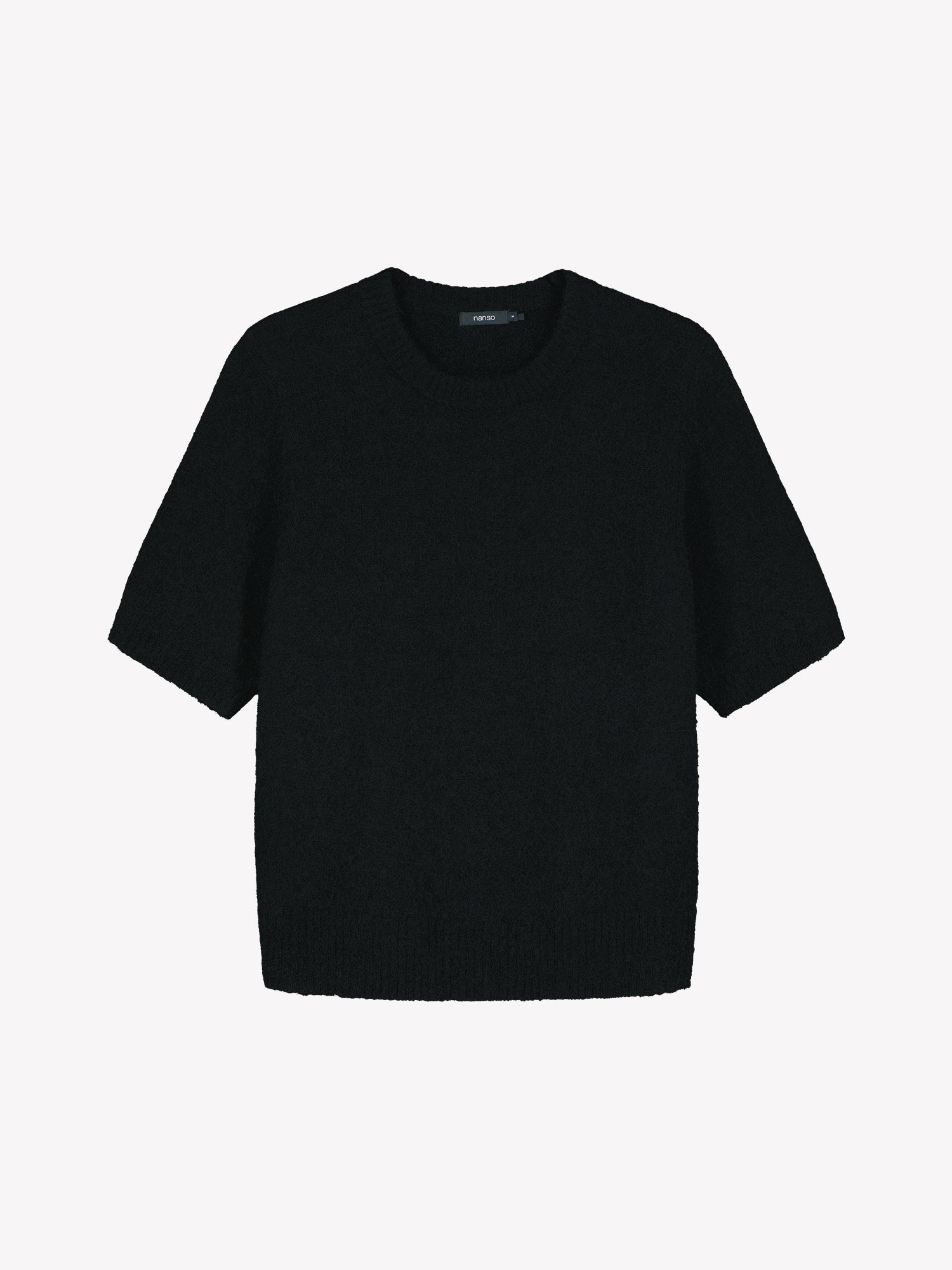 Nanso women’s Tuohi knit sweater in black, hip-length style with round neckline and short half sleeves, in product photo.