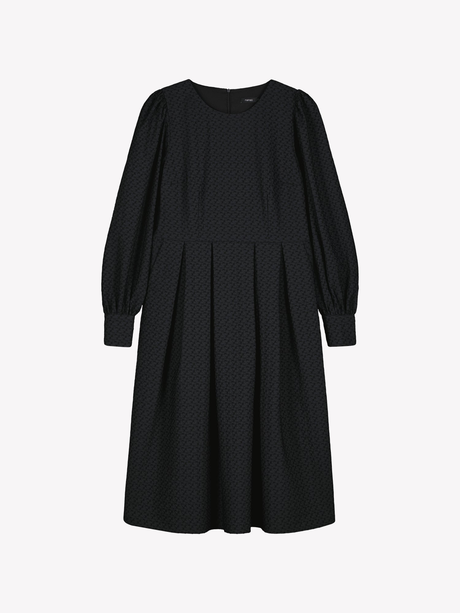 Nanso women’s black Reliefi dress, midi-length style with long gathered sleeves, pleated waist and side pockets, in product photo.