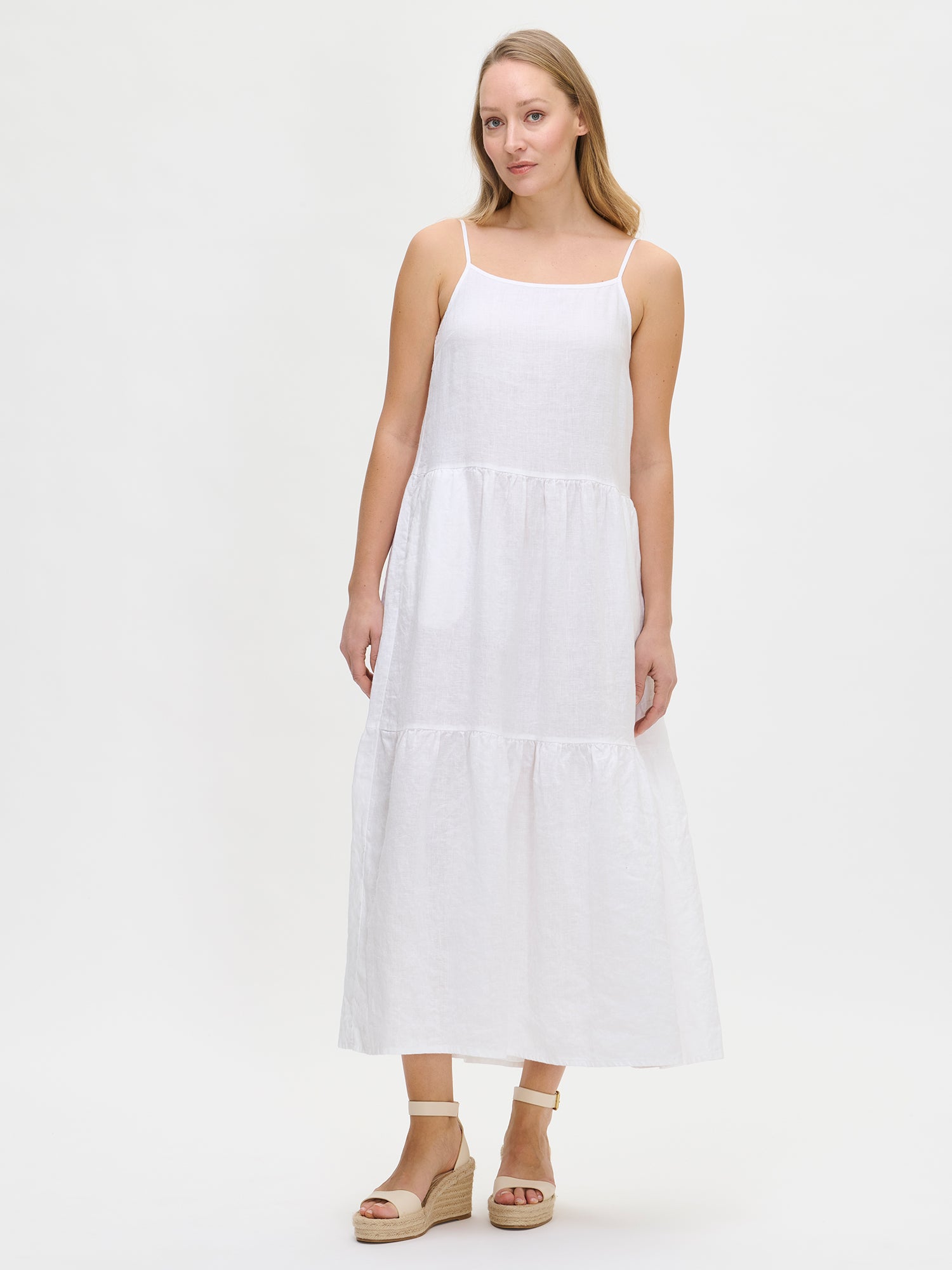 Woman wearing a white dress on a white background