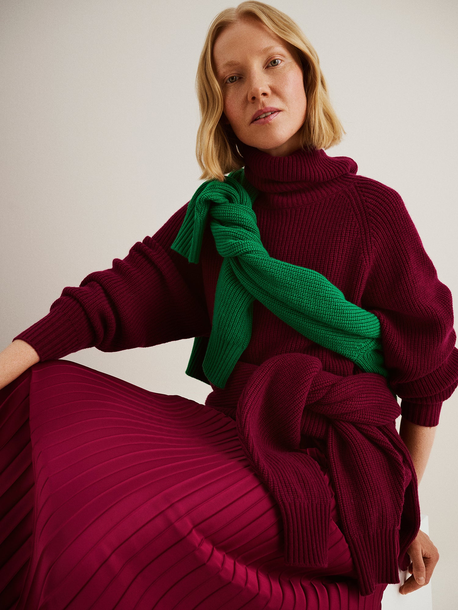 Nanso's relaxed burgundy Pamela knit tunic, on a model