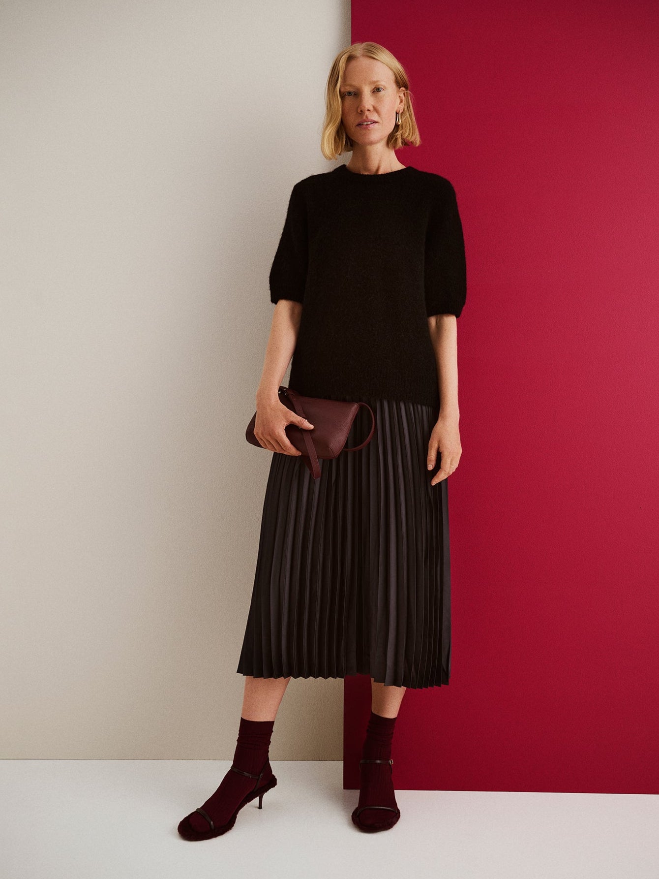 Nanso sleek burgundy Naru leather bag, on a model