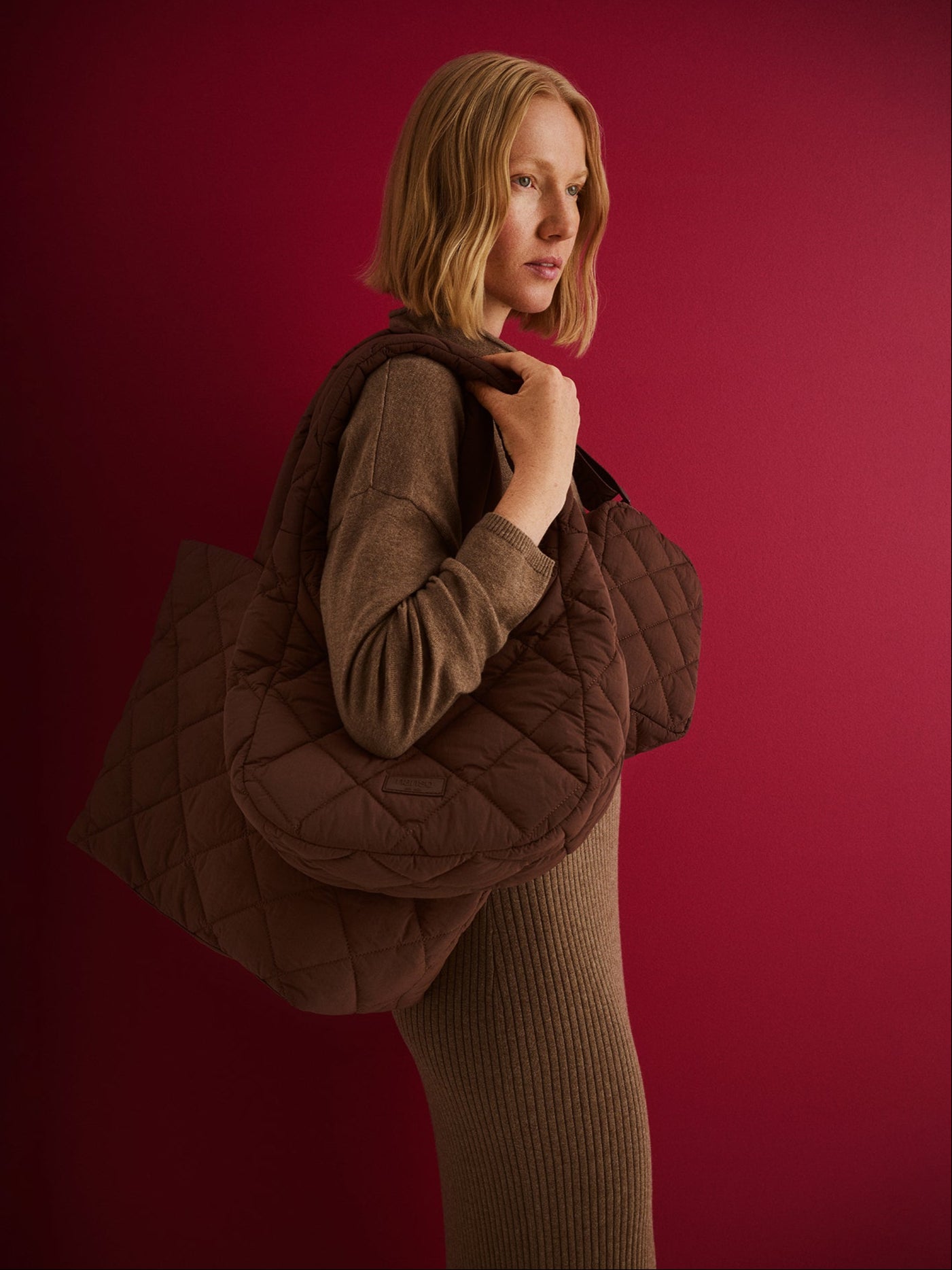 Nanso women's brown vanu bags, carried by a model.