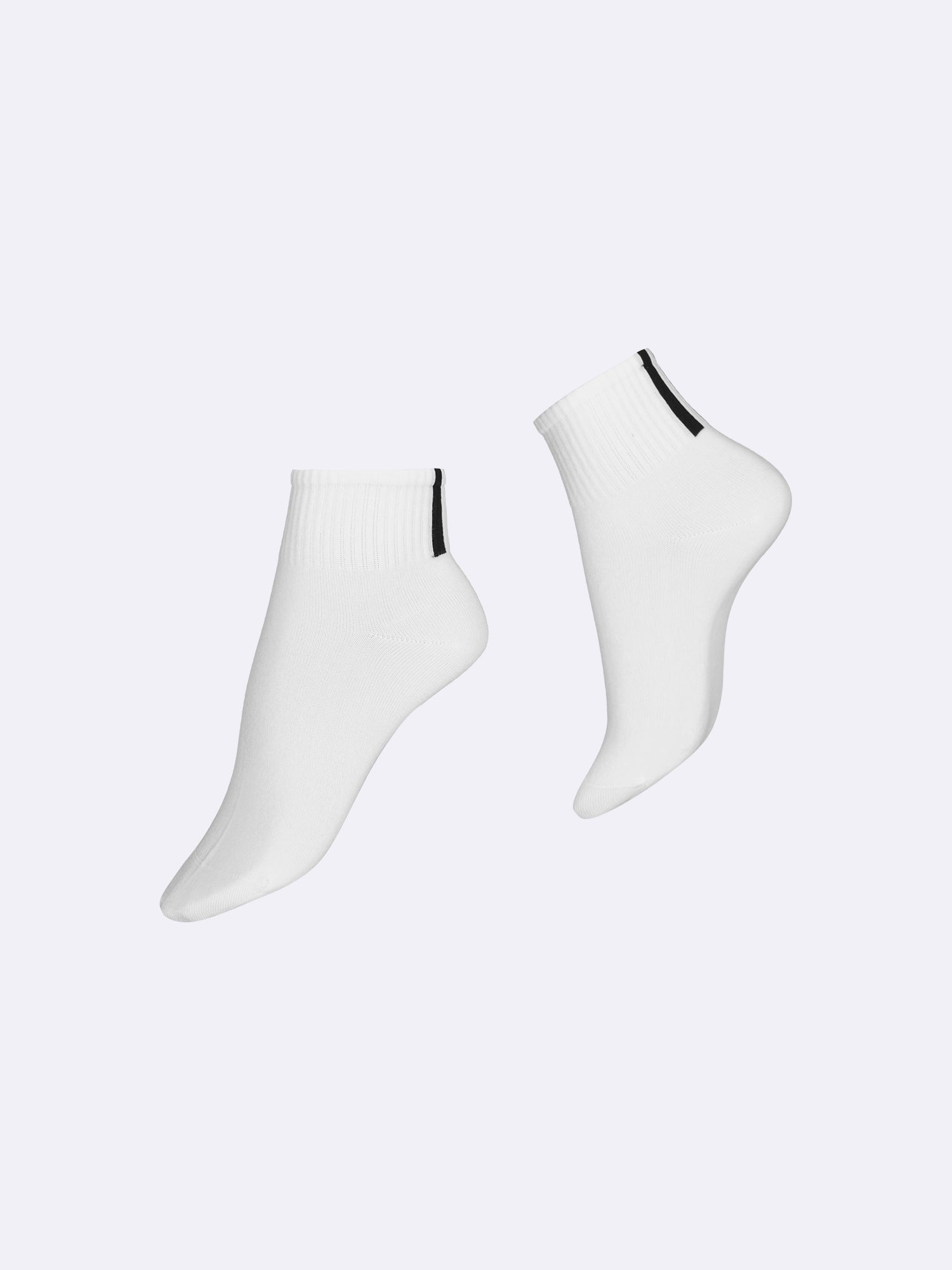 Vogue women's white Cristina lyocell sneaker socks with a contrast black stripe in back.