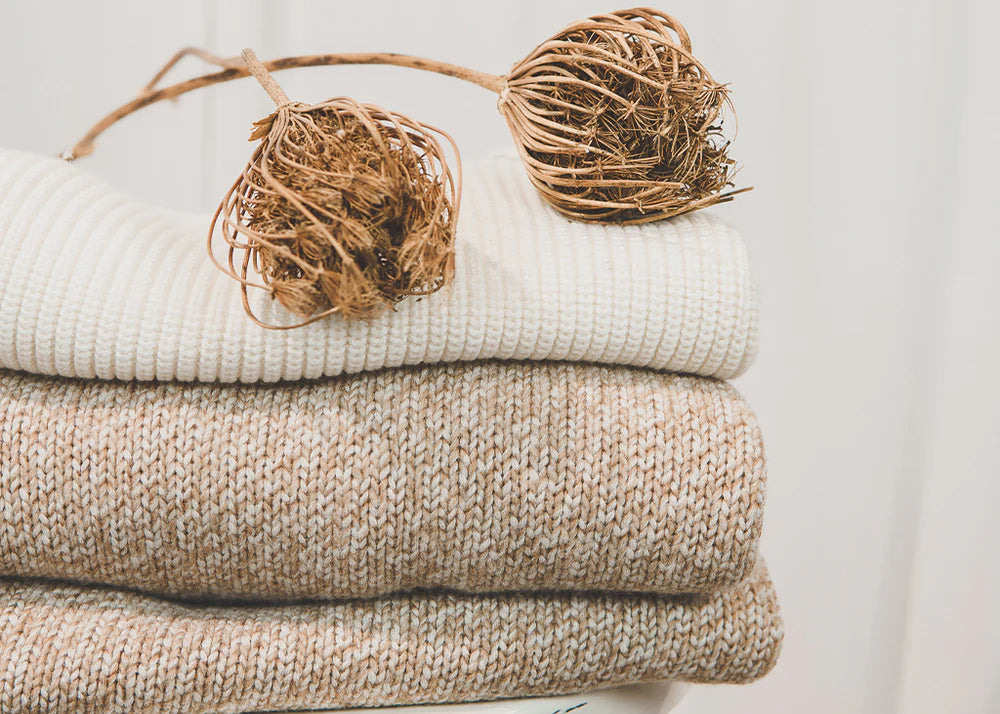 Nanso knits on a pile in natural colours