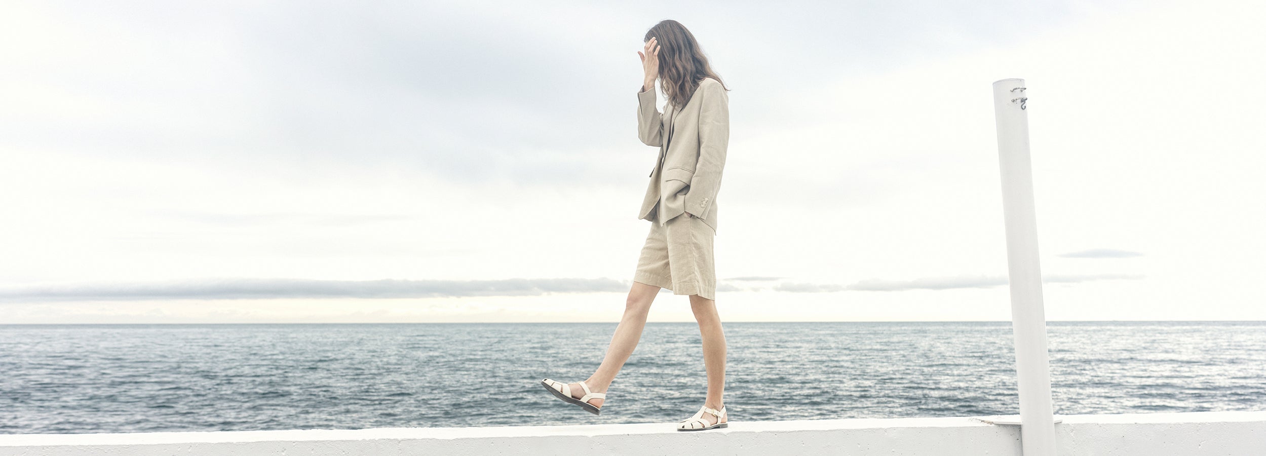 Nanso beige Arles blazer and shorts, worn by female model