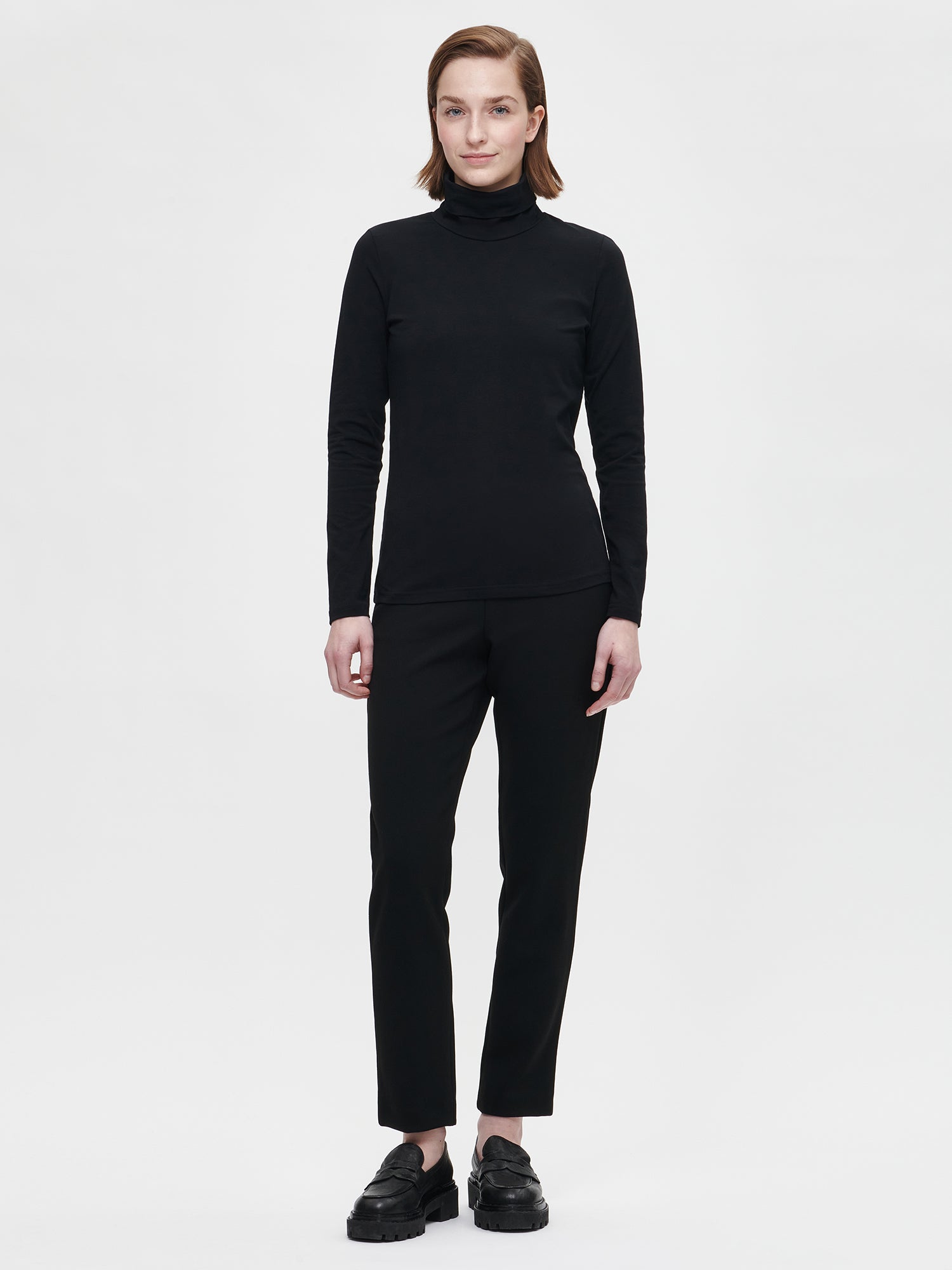 Nanso Women's black Tarina trousers, on a model from front.