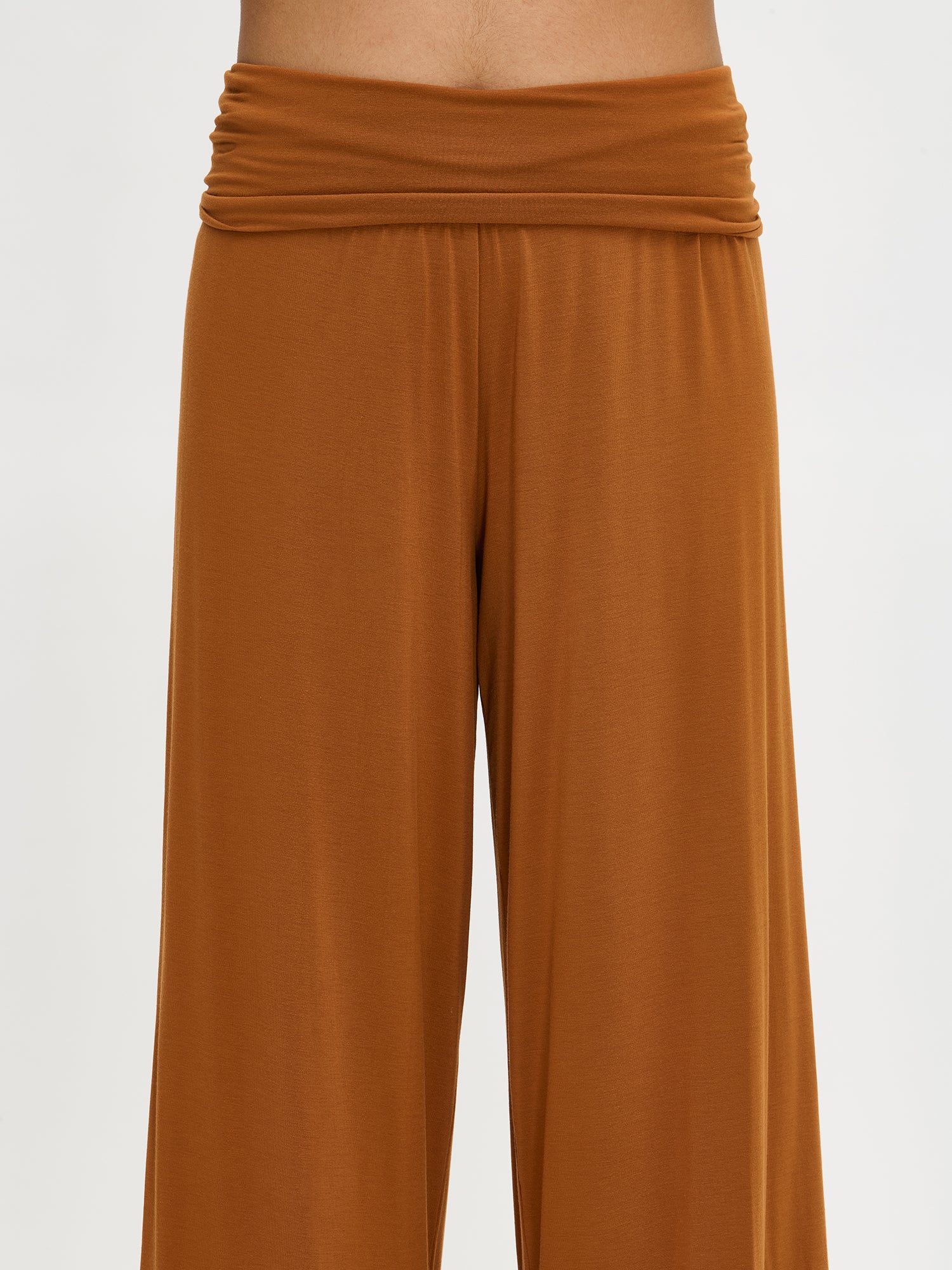 The wide waistband of Hento pants photographed on a model.