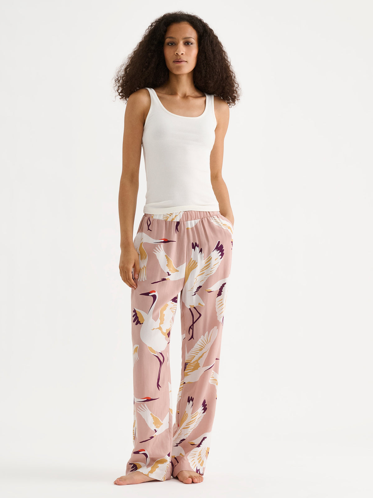 Nanso women's Heila ribbed top in off white on a model with patterned pajama pants. | S - 180cm