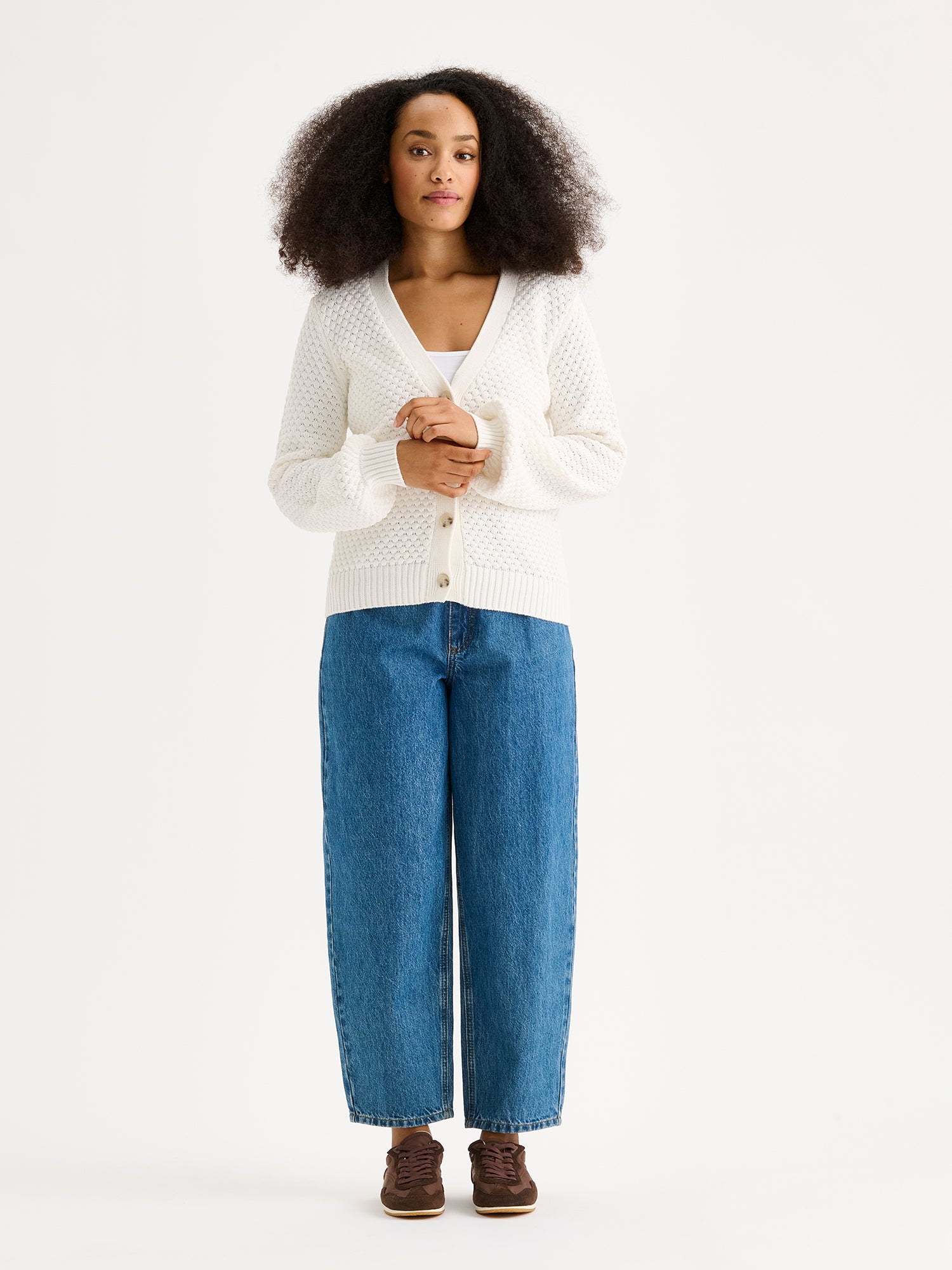 women's KUMPU Knit Cardigan in off white on a model with jeans.