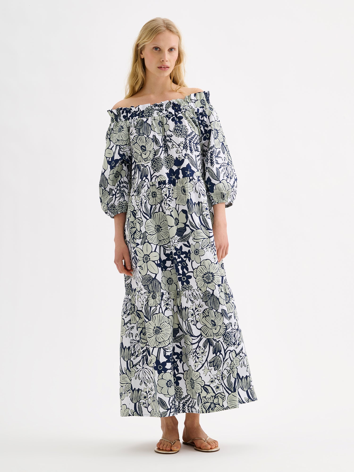 Nanso women's beautifully relaxed floral patterned summer dress, the HUVILA Long Dress, on a model with blonde hair.