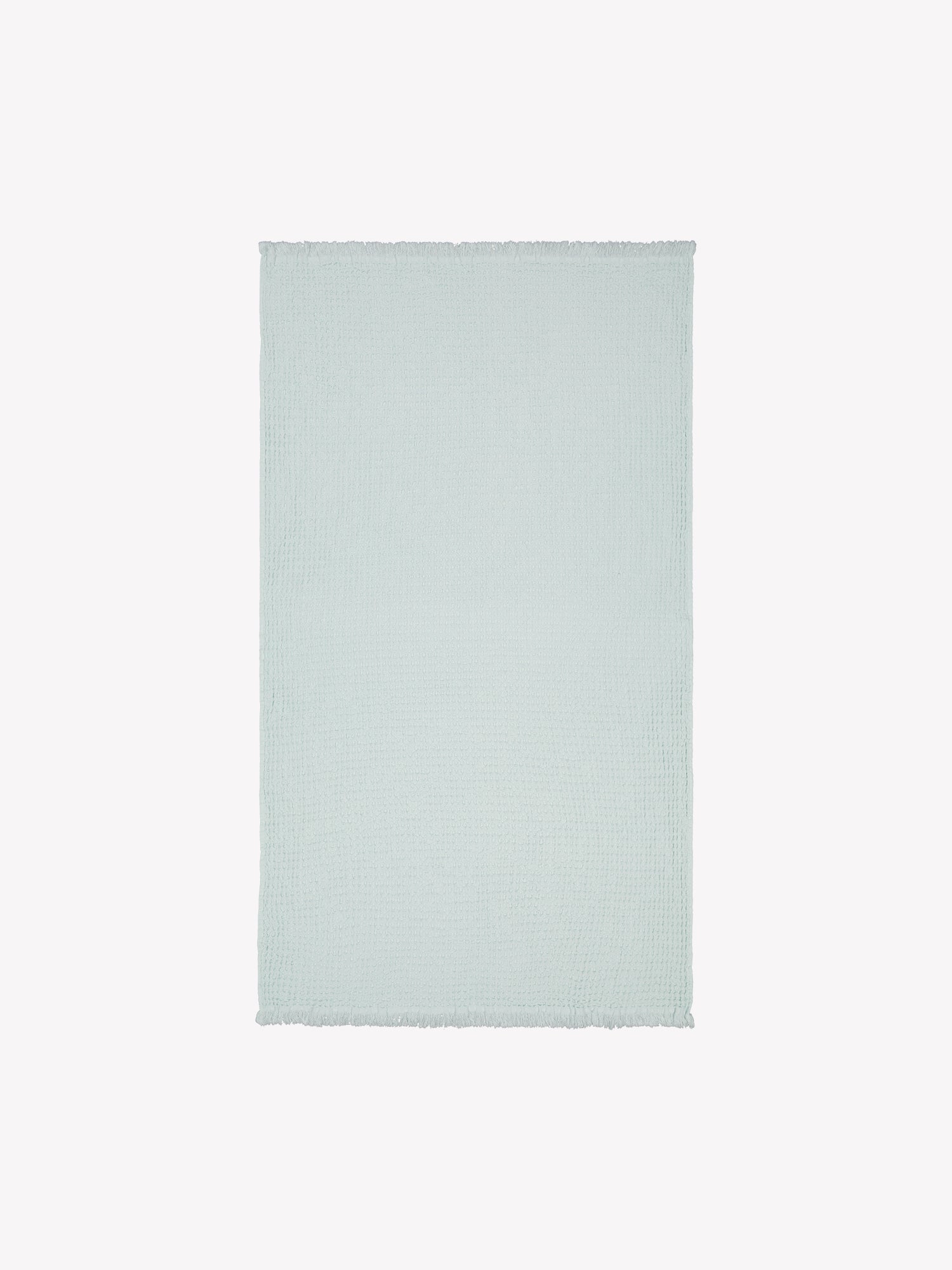 The Vohveli Bath towel in Mint in a product picture.