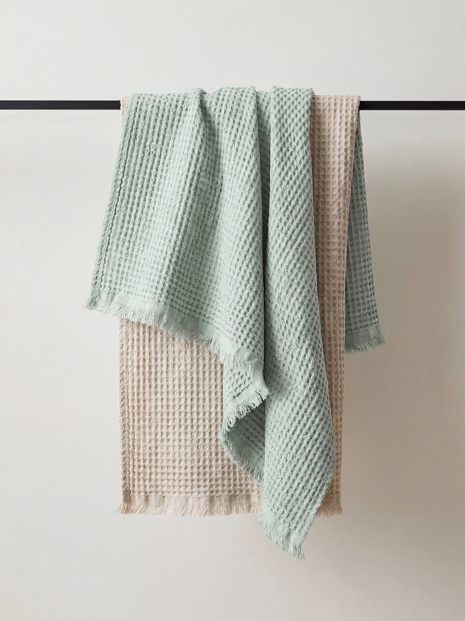 Nanso home's Vohveli Bath towels hanging on a rail