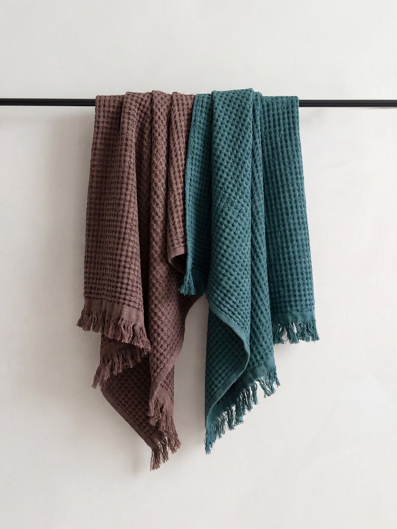 Nanso home's Vohveli Bath towels hanging on a rail