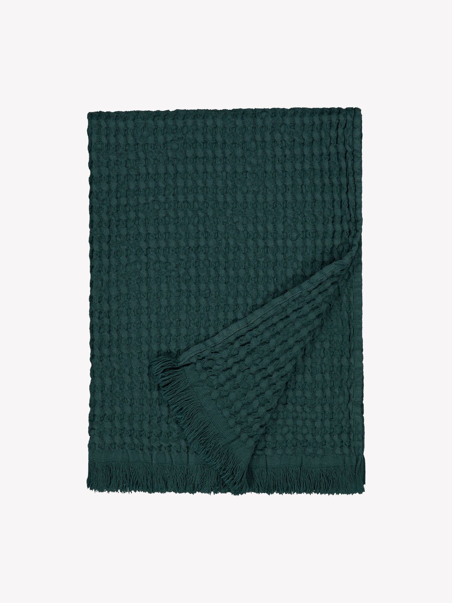 Vohveli hand towel in beautiful dark green offers a perfect blend of the nostalgic waffle fabric and modern design. Product picture