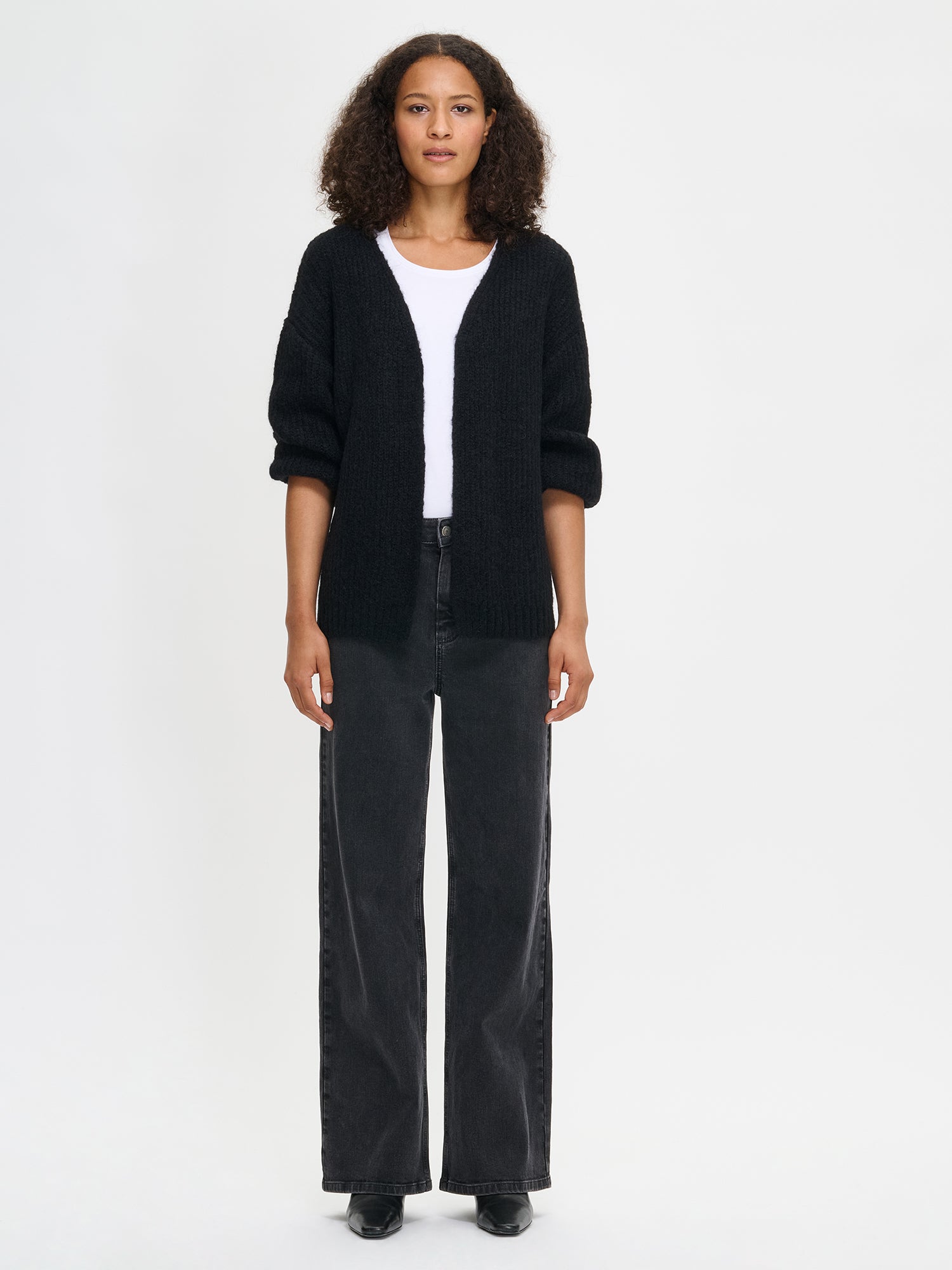 Nanso's women's luxurious  black knit Karamelli cardigan, front