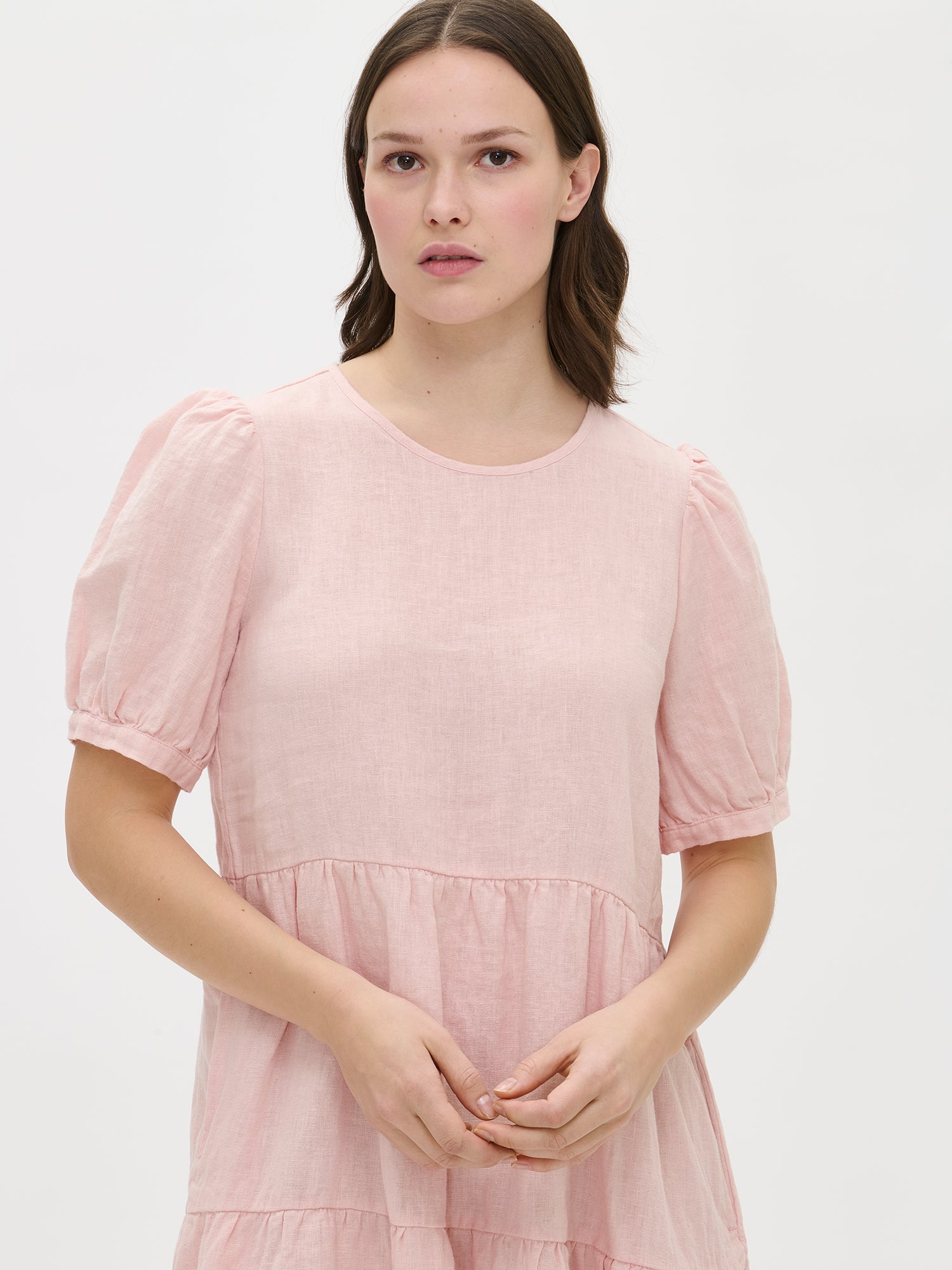 Nanso women's beautiful light pink Sarastus linen dress with voluminous frill layers and short puff sleeves, front.